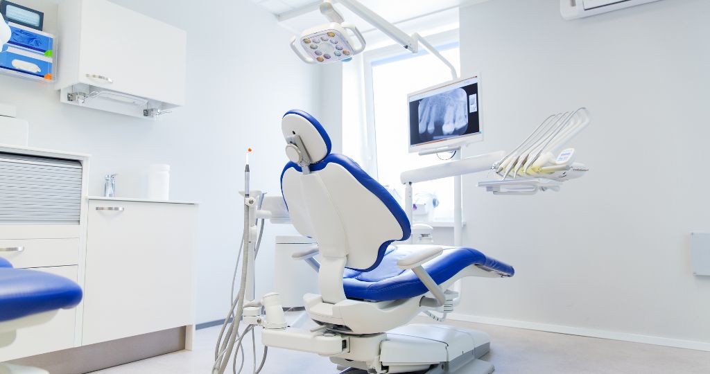 Modern dental or aesthetic clinic setup with equipment and patient chair