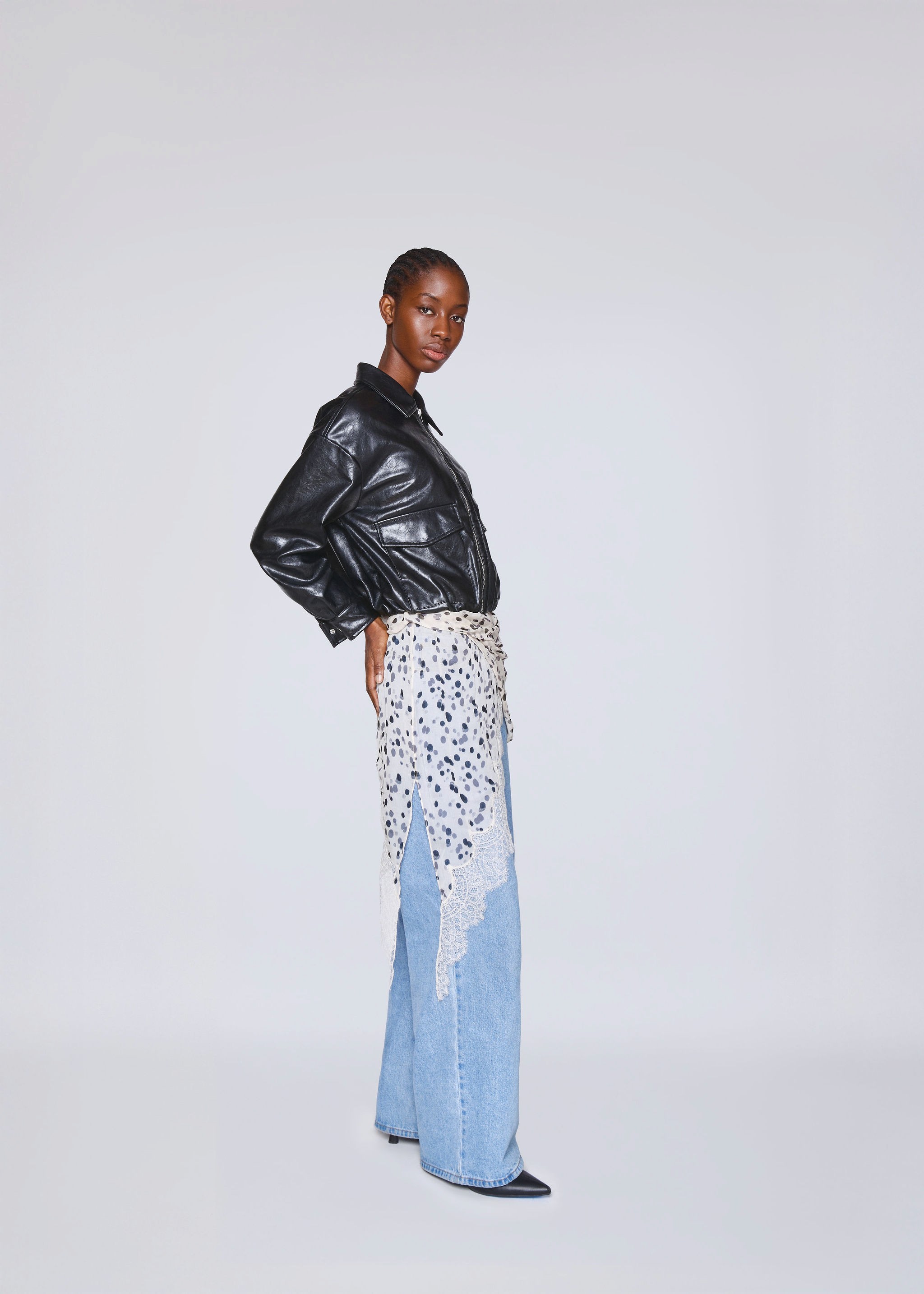 American flag flying against a cloudy sky