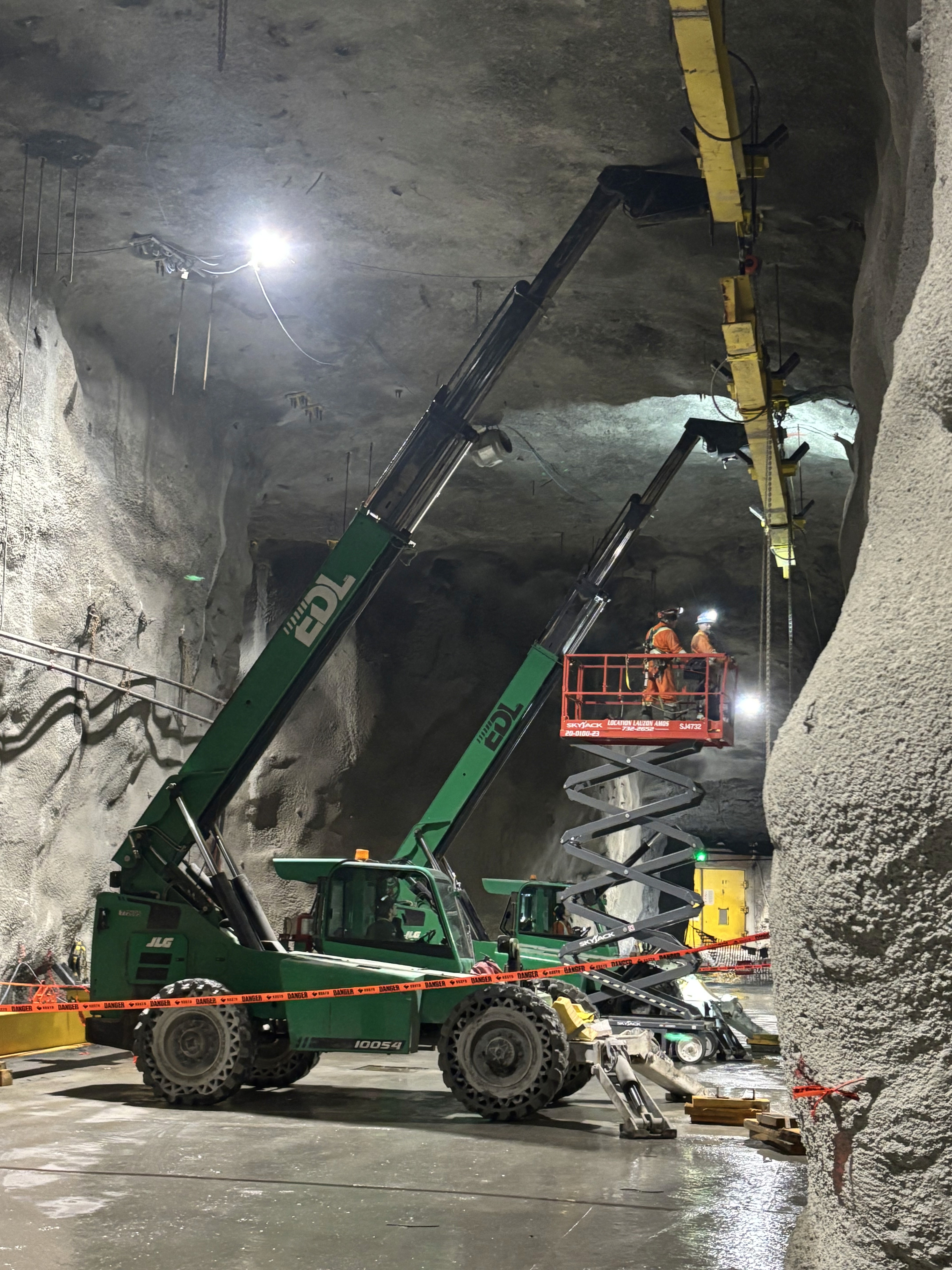 yellow and black heavy equipment on snow covered ground during daytime