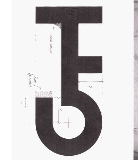 A logo with notes made with pencil about the design.