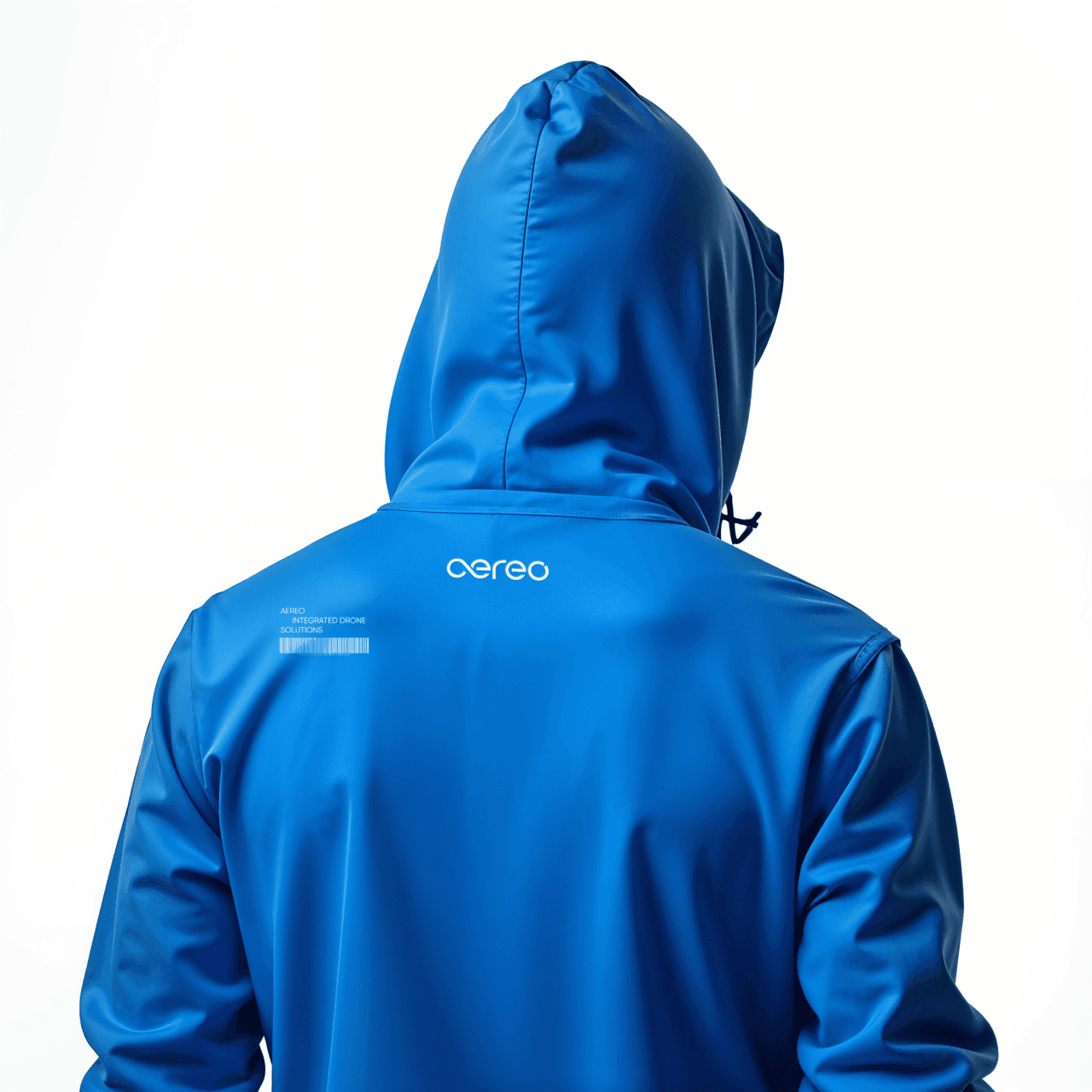 Team member in branded blue gear showcasing field-ready drone operation identity