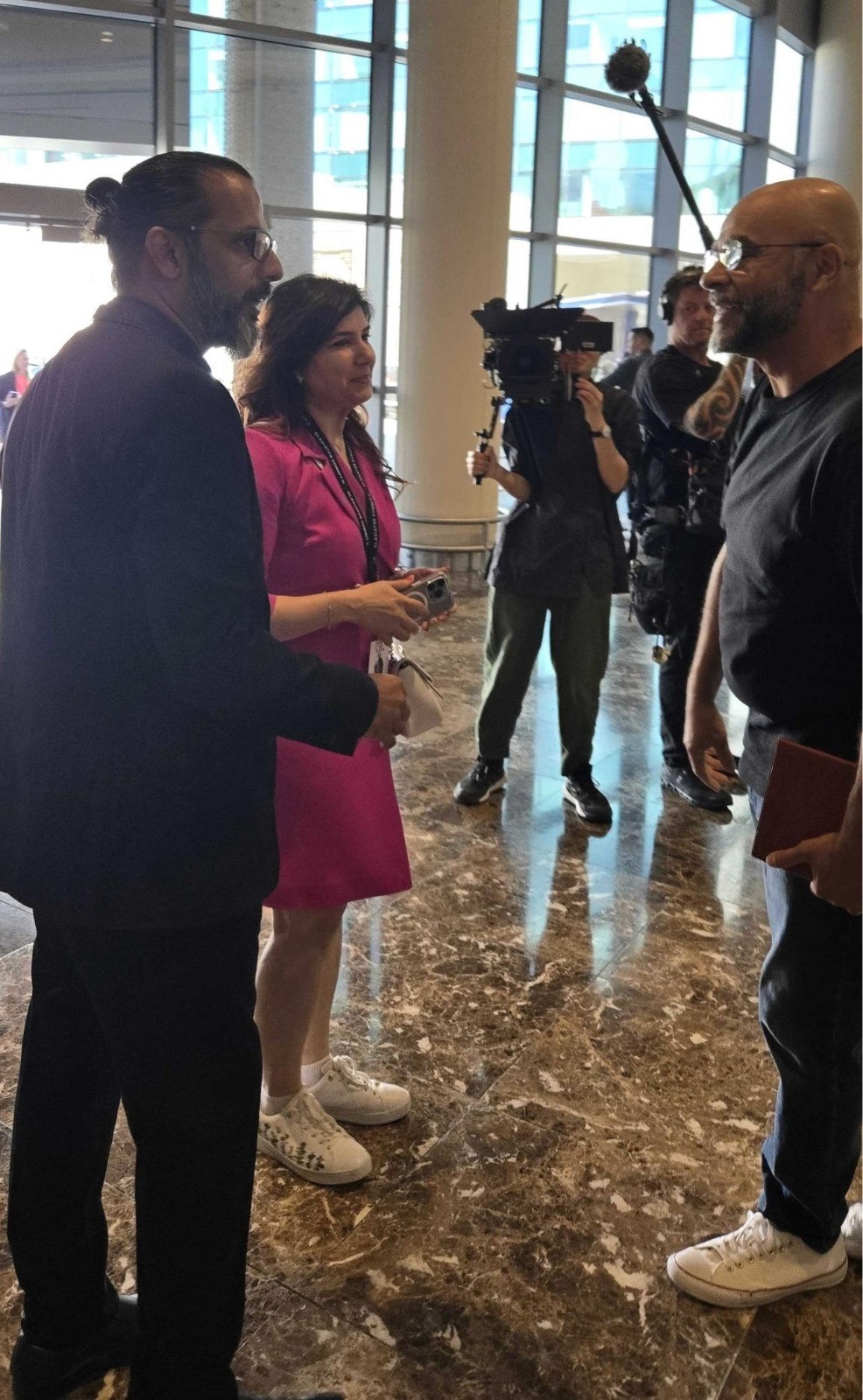 Tanu Chopra speaking with media at an event