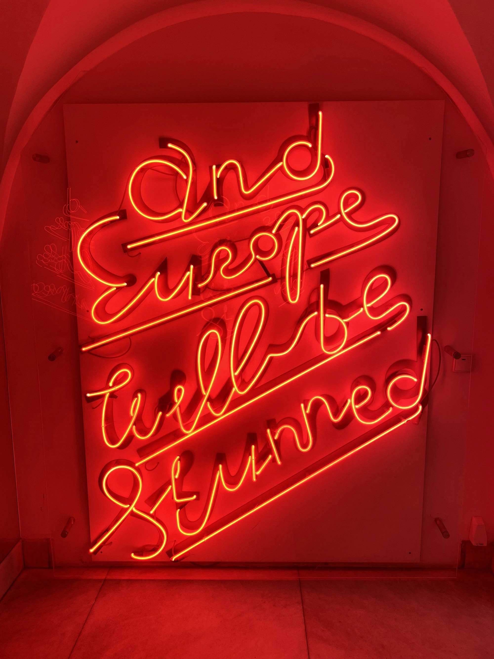 people in a large building with Tate Modern in the background