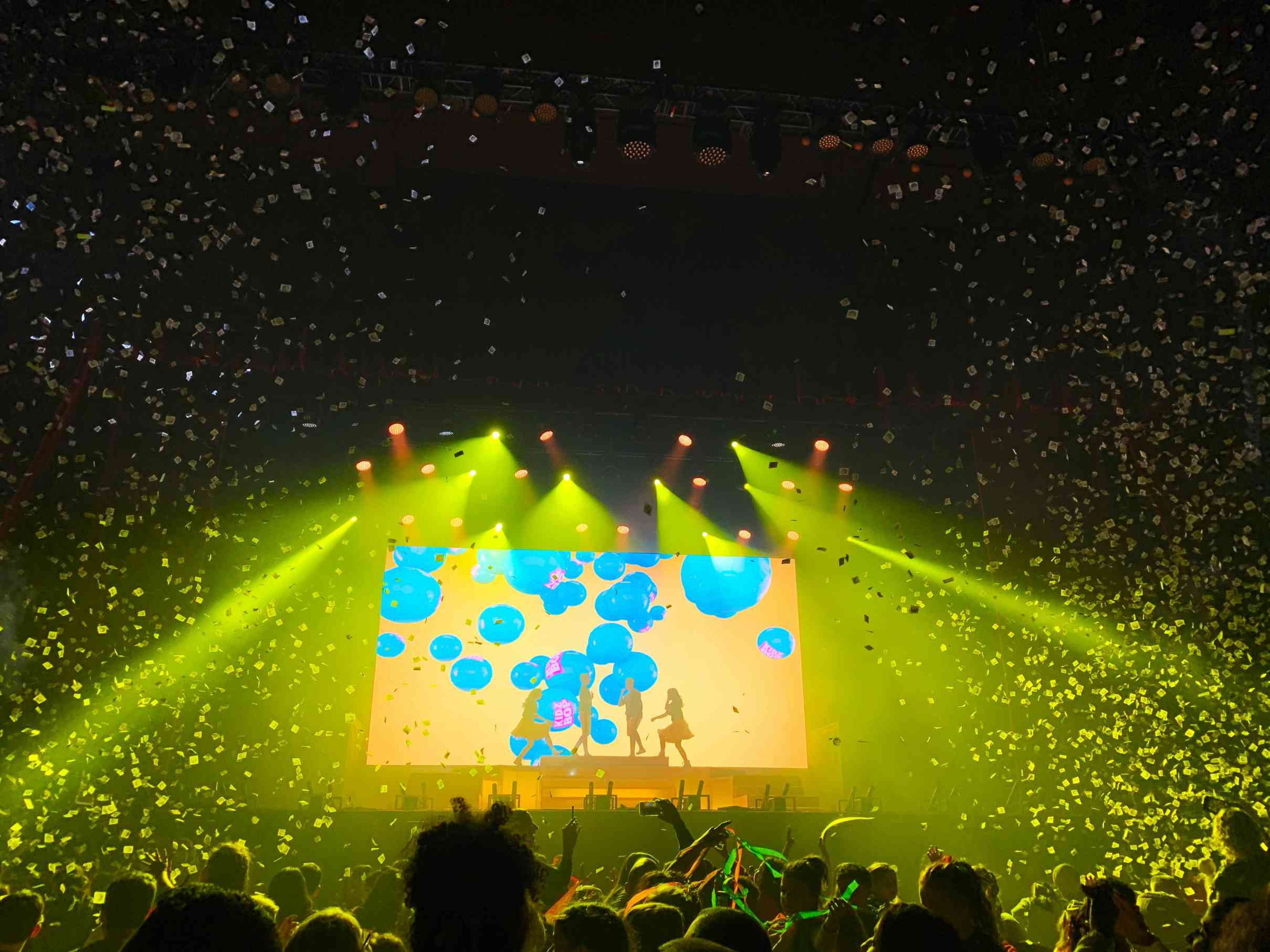 Immersive live concert stage design with colorful visuals and confetti effects