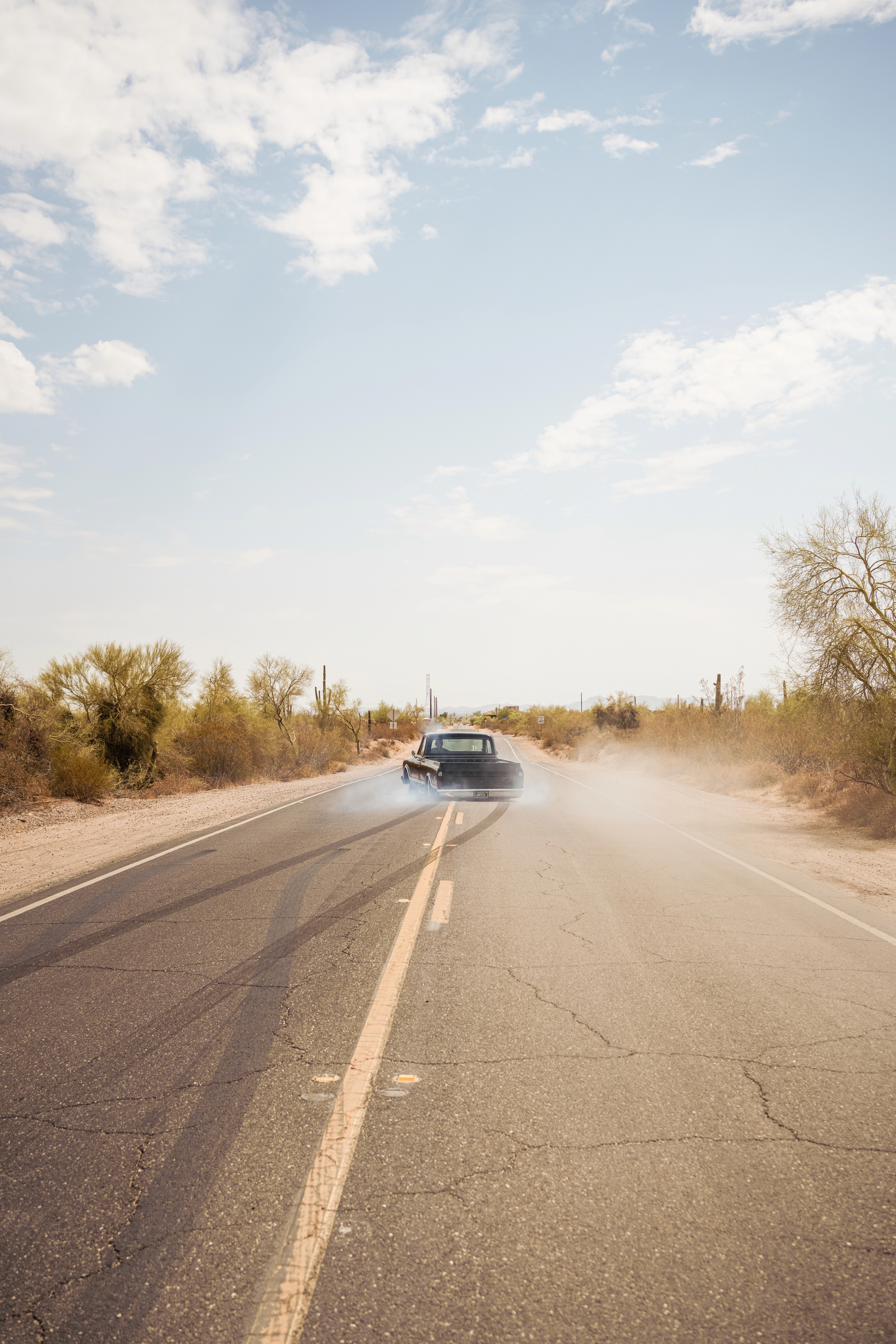 A well-composed photograph of a girl behind rocks.