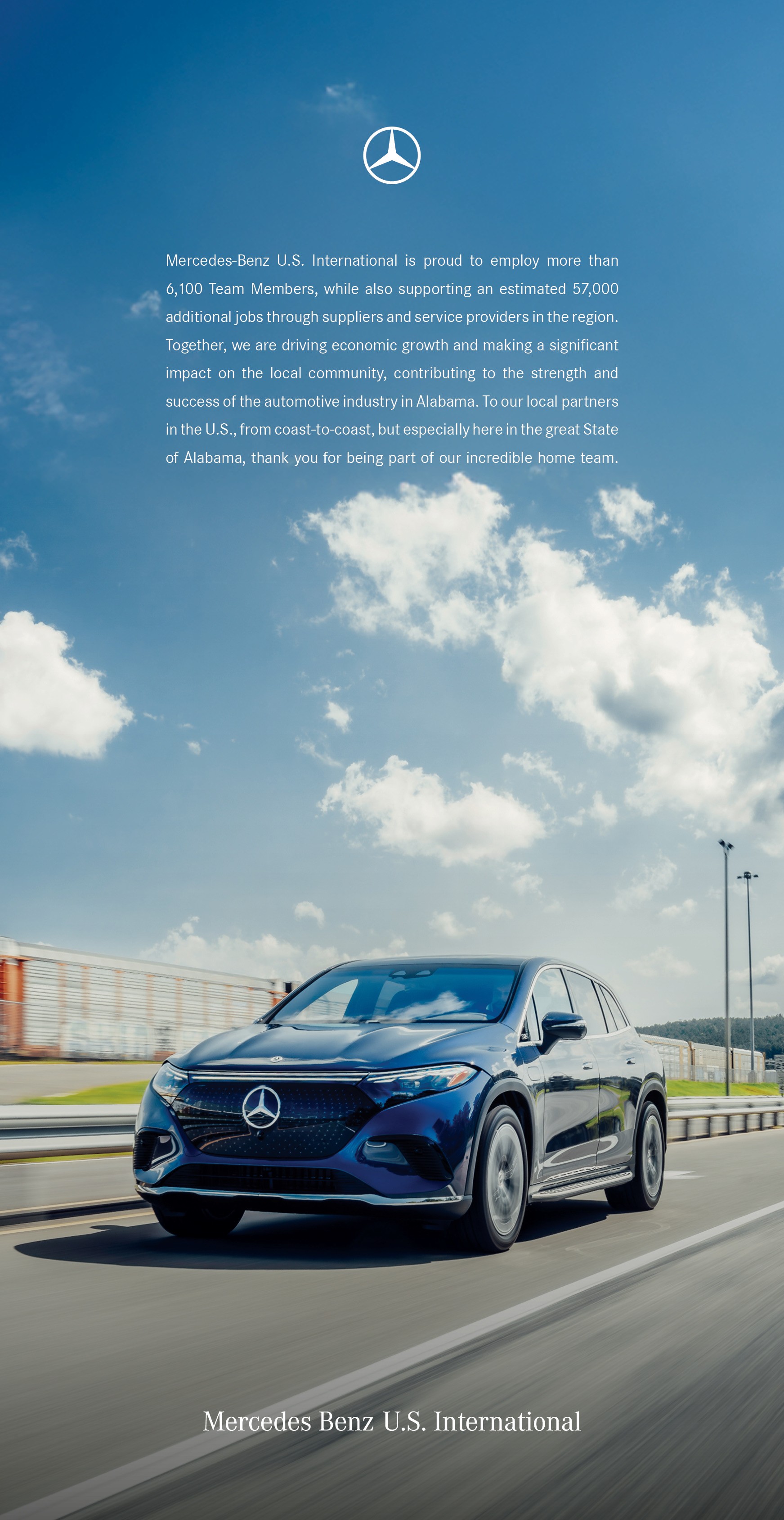 Mercedes-Benz U.S. International ad featuring a blue electric SUV driving past an industrial facility beneath a bright sky, with a message about Alabama jobs and economic impact.