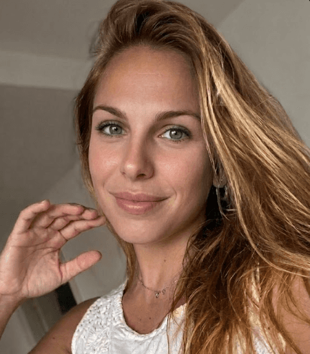 A person wearing the white shirt looking at the left