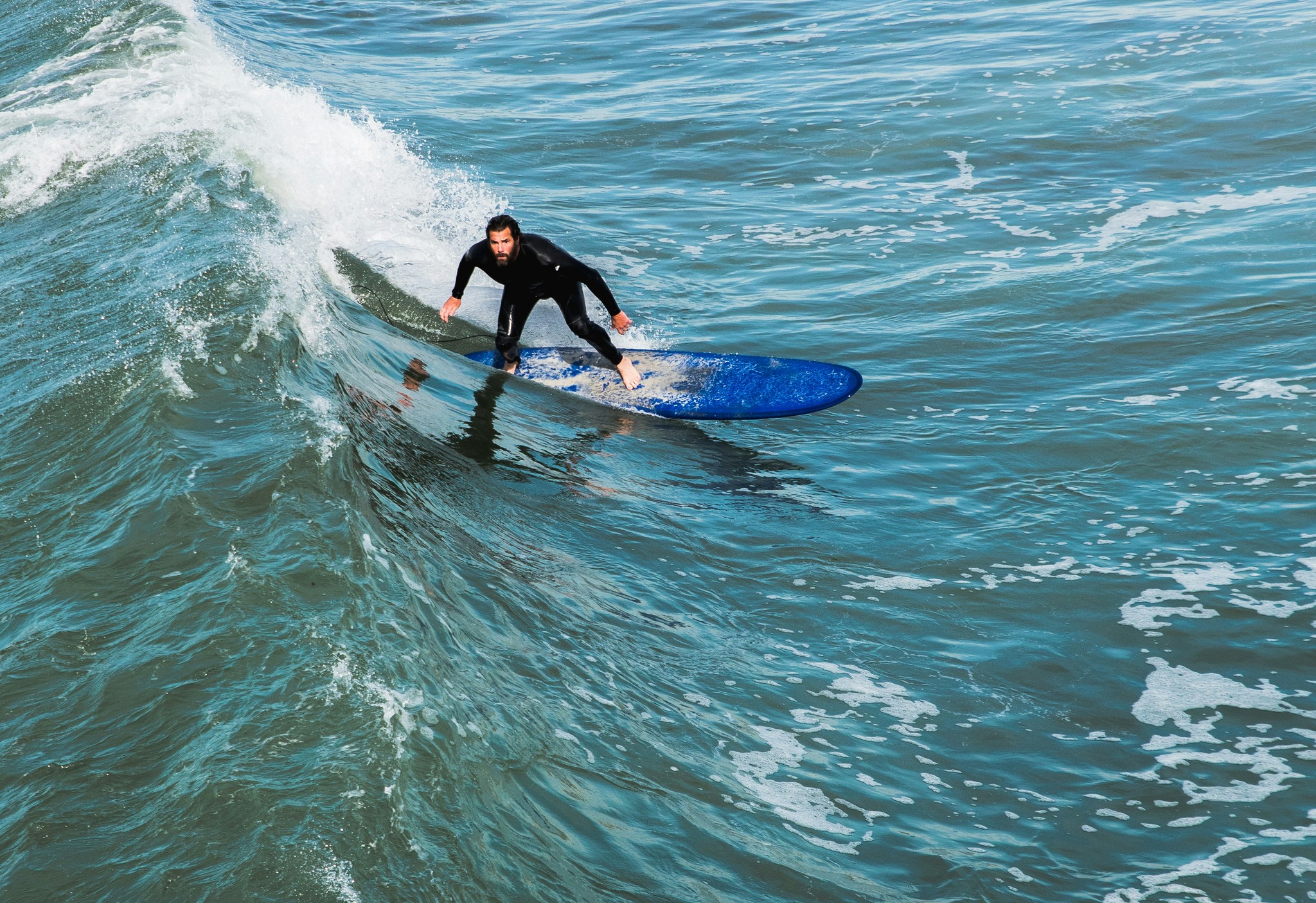 human surfing confidently in the sea