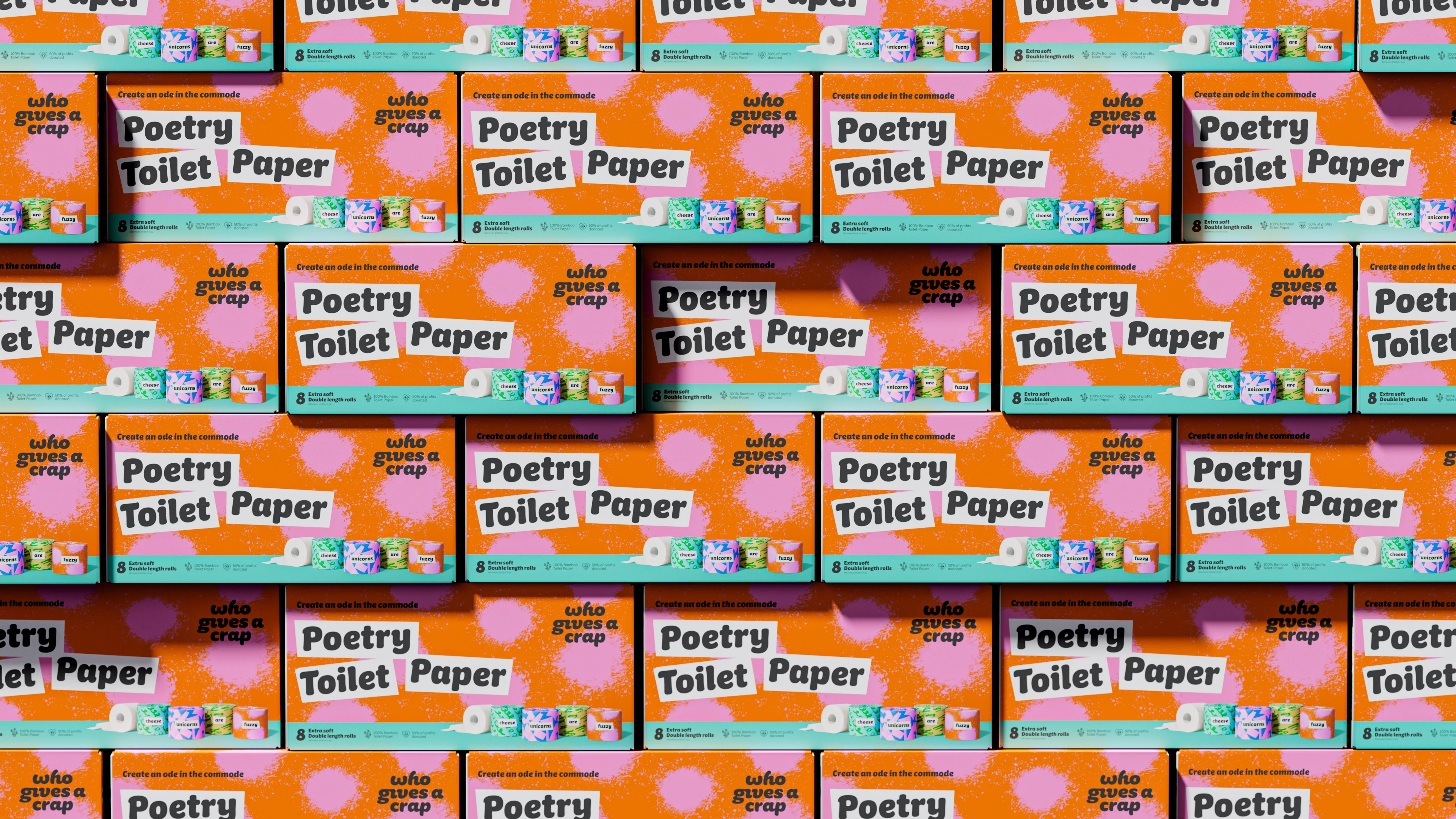 Wall of orange and pink Who Gives A Crap Poetry Toilet Paper boxes, eight double-length rolls each