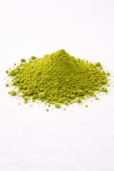 isolated L-THEANINE green powder on a white background.