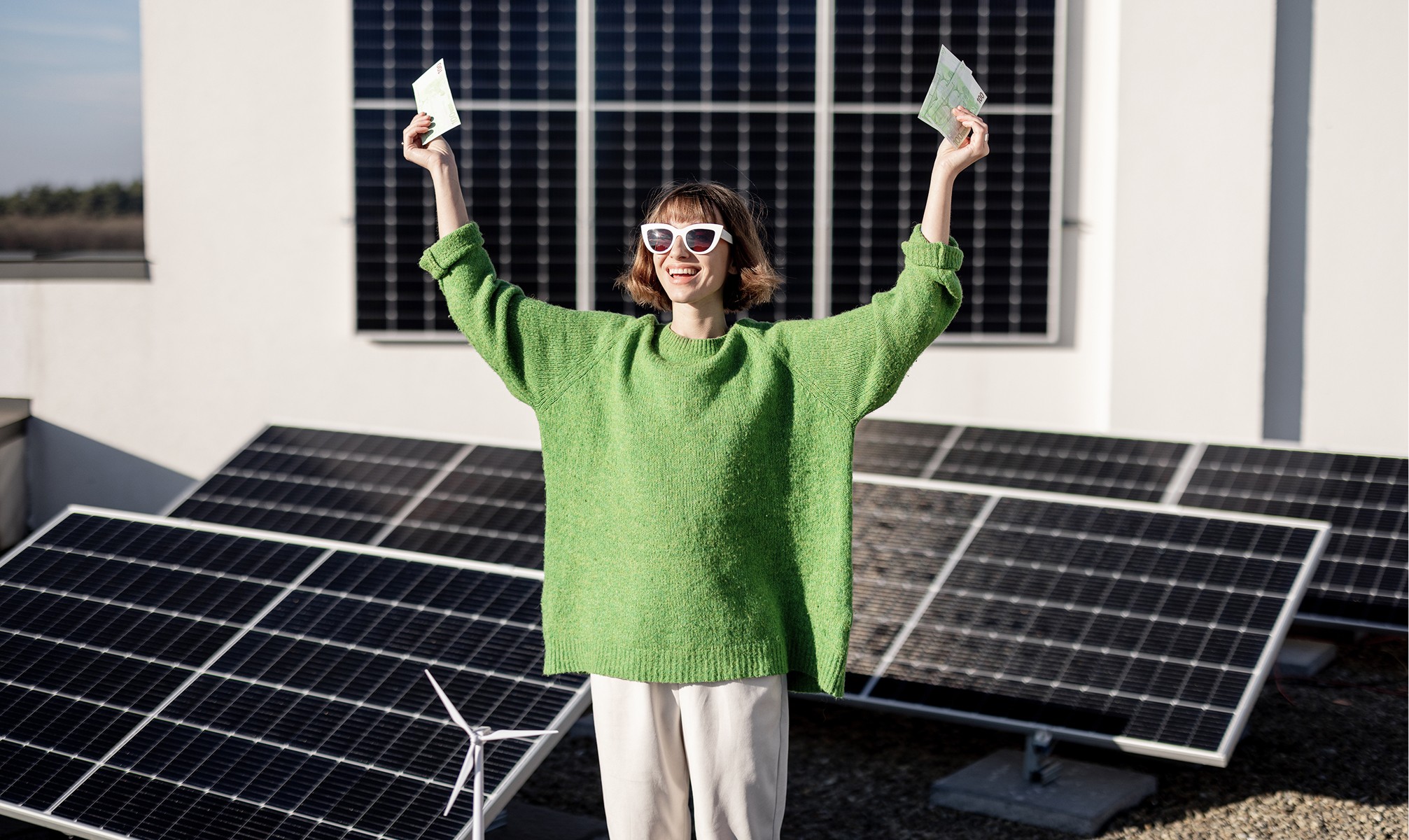 a women in front of a solar panel