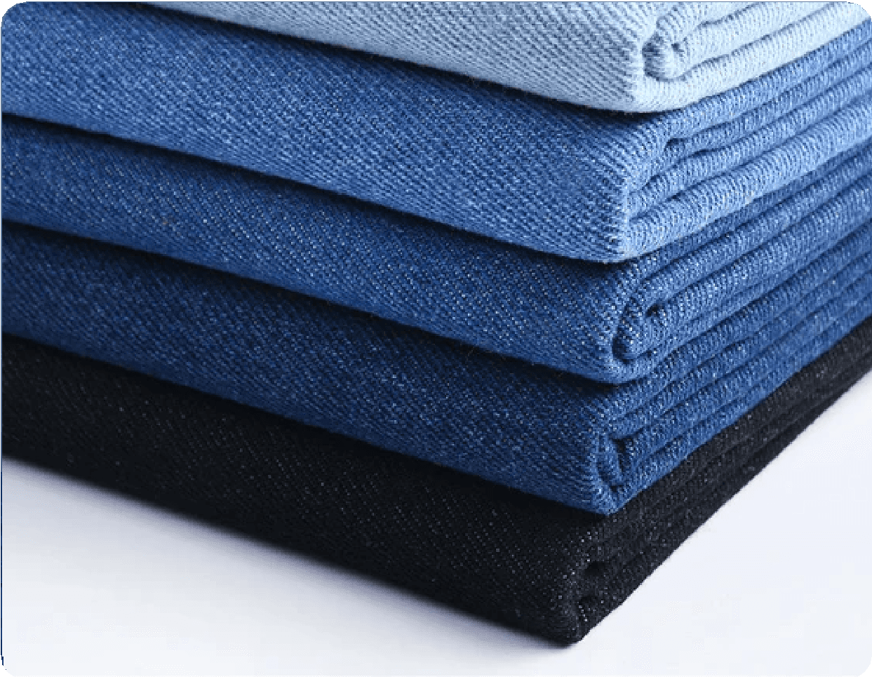 Stack of jeans in different shades of blue, from light to dark.
