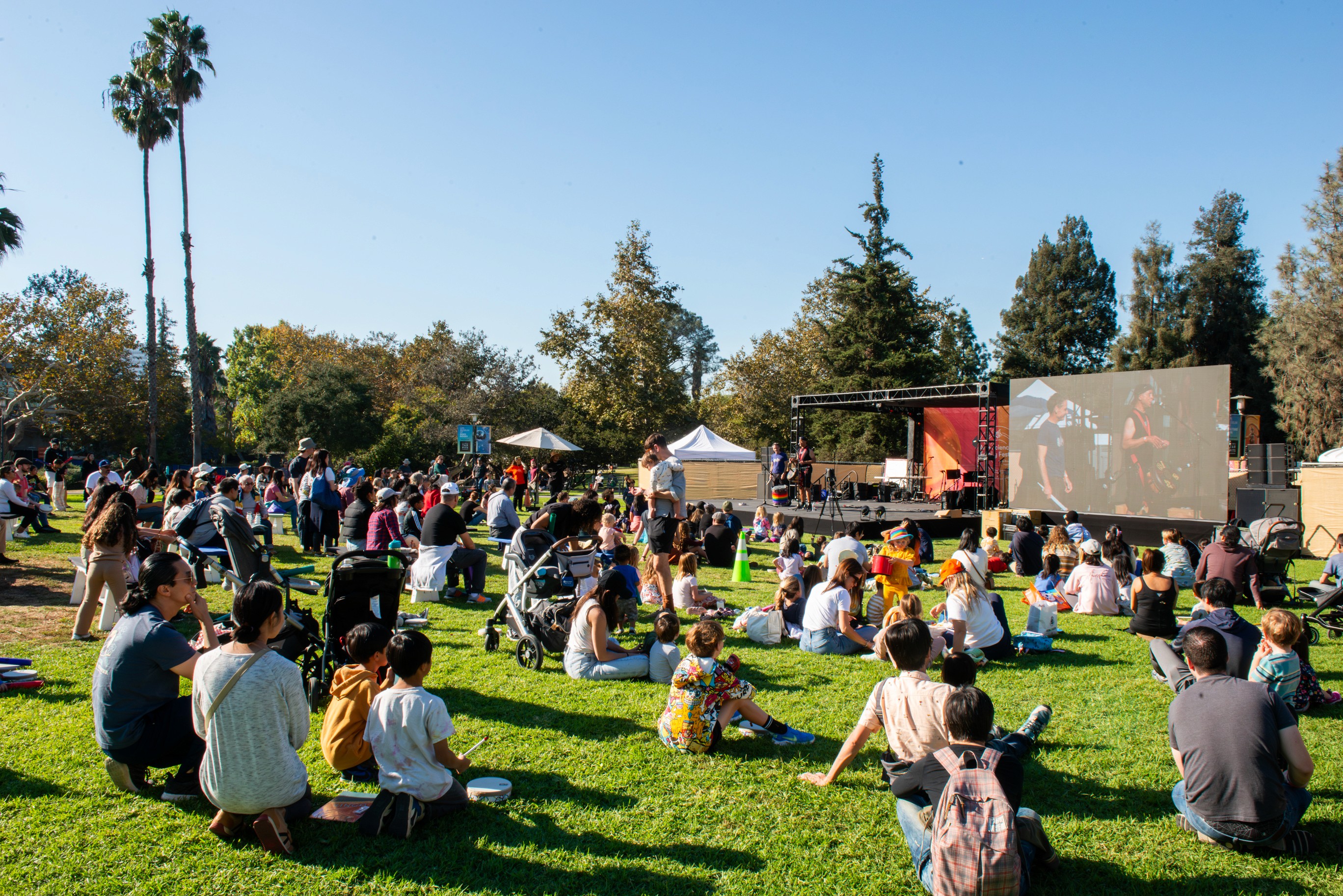 A wide view of the family-friendly event layout on the museum's grassy lawn.