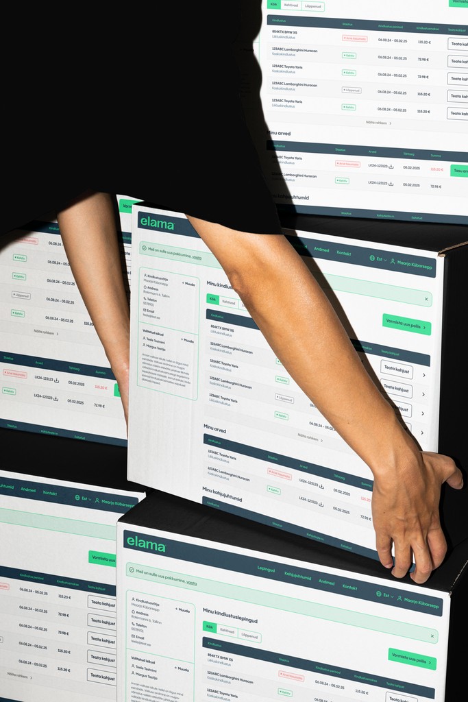 Hands reaching to a box that has dashboard printed on it.