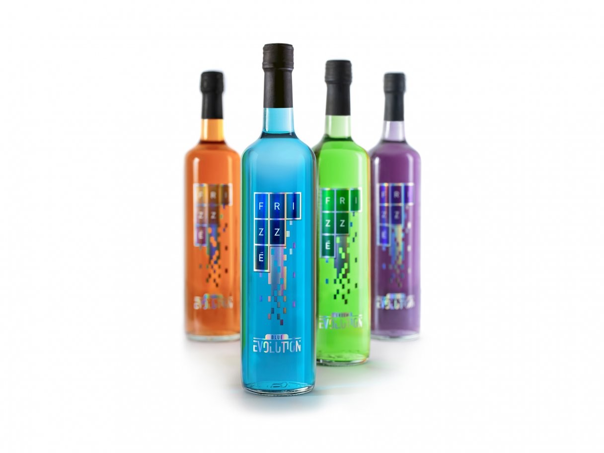 Rooftops of a coastal town with the sea in background