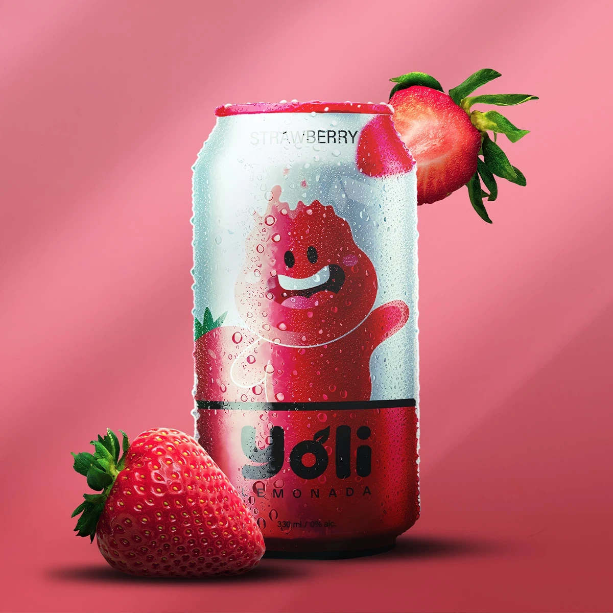 Strawberry flavored Yoli lemonade can with strawberries on pink background, cold drink.