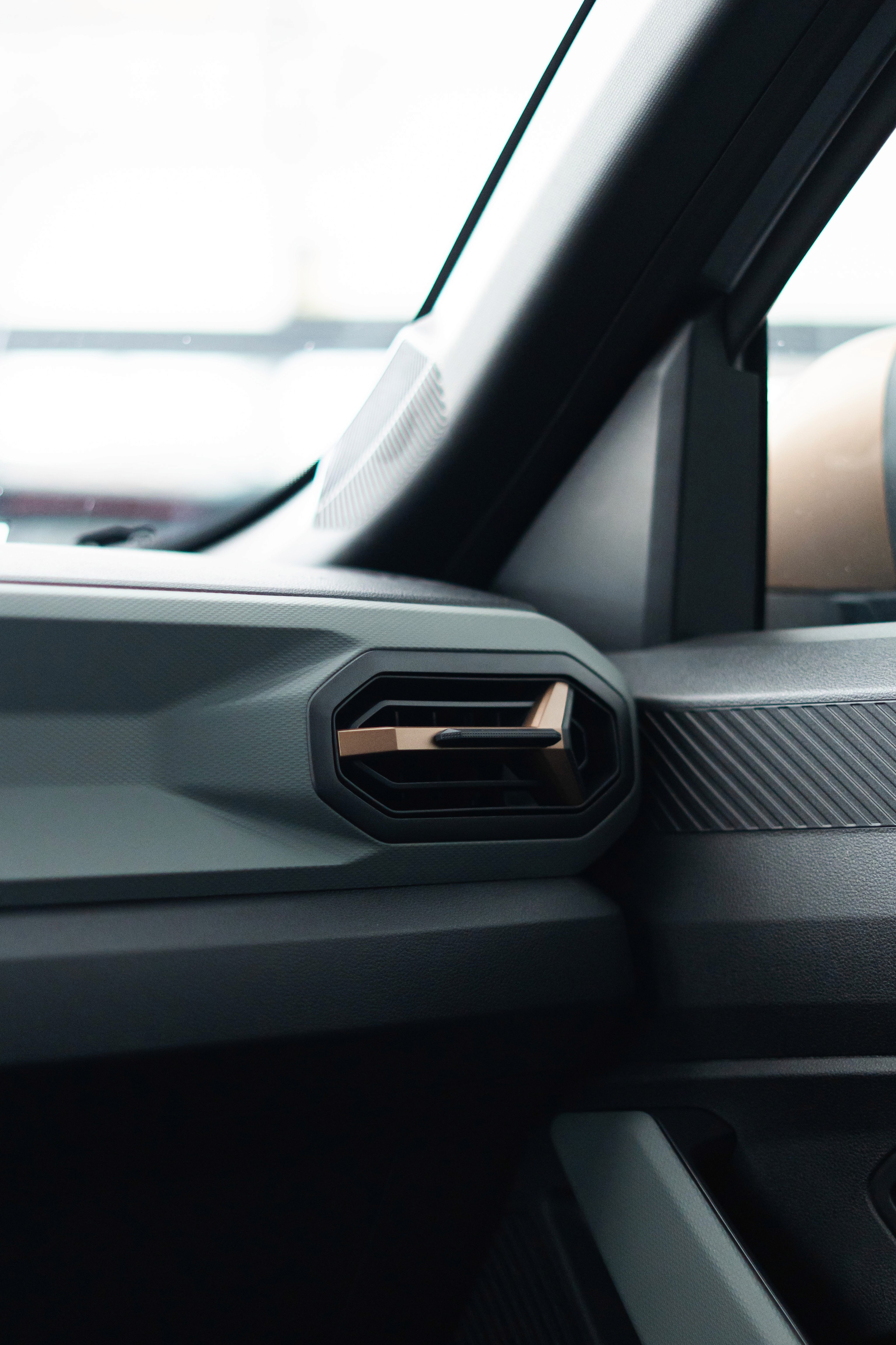 A woman with a head made of mirrors, reflecting light and creating a kaleidoscopic effect around her.