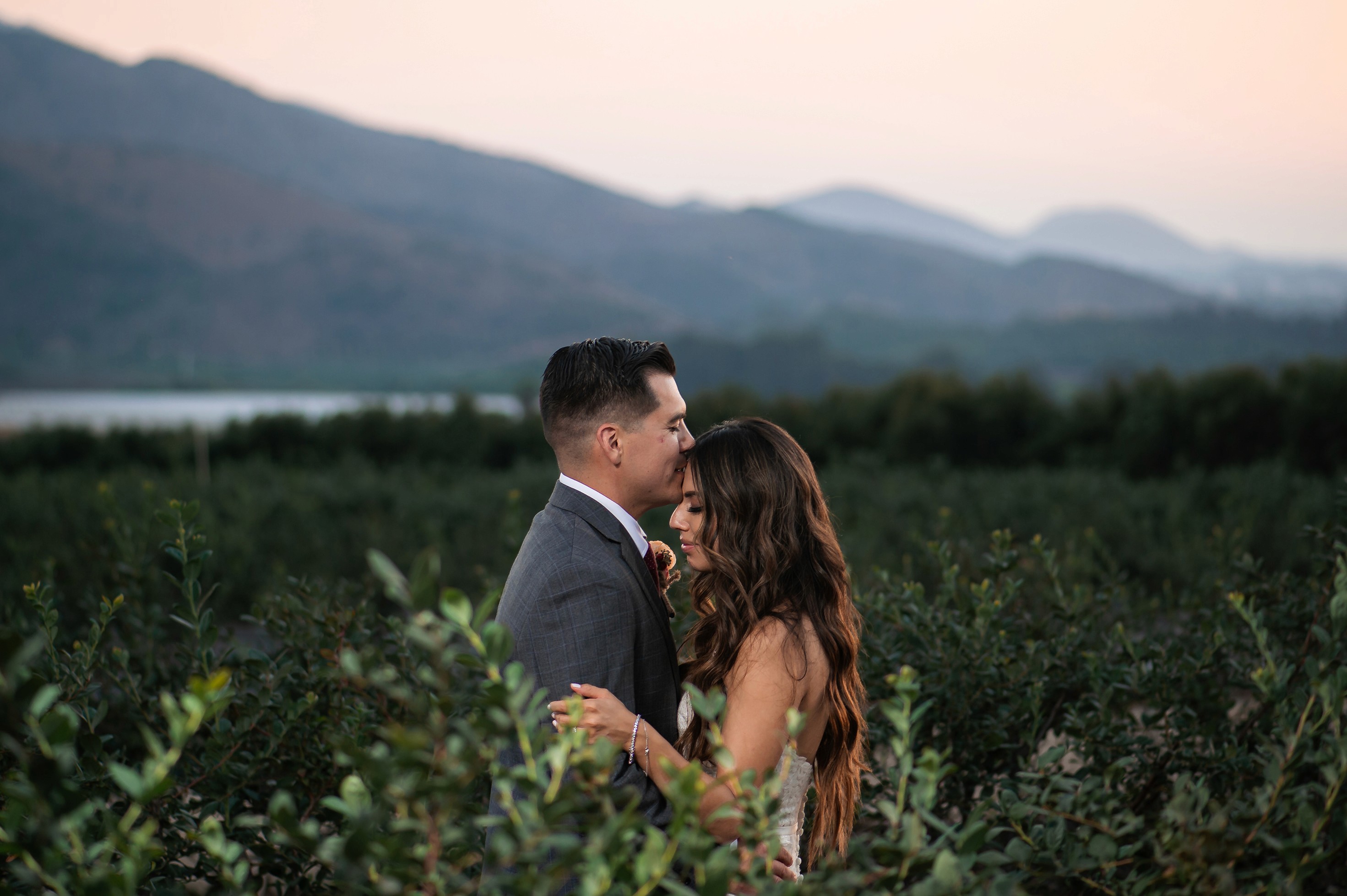 Bride and groom portraits with mountains in the background at Gerry Ranch