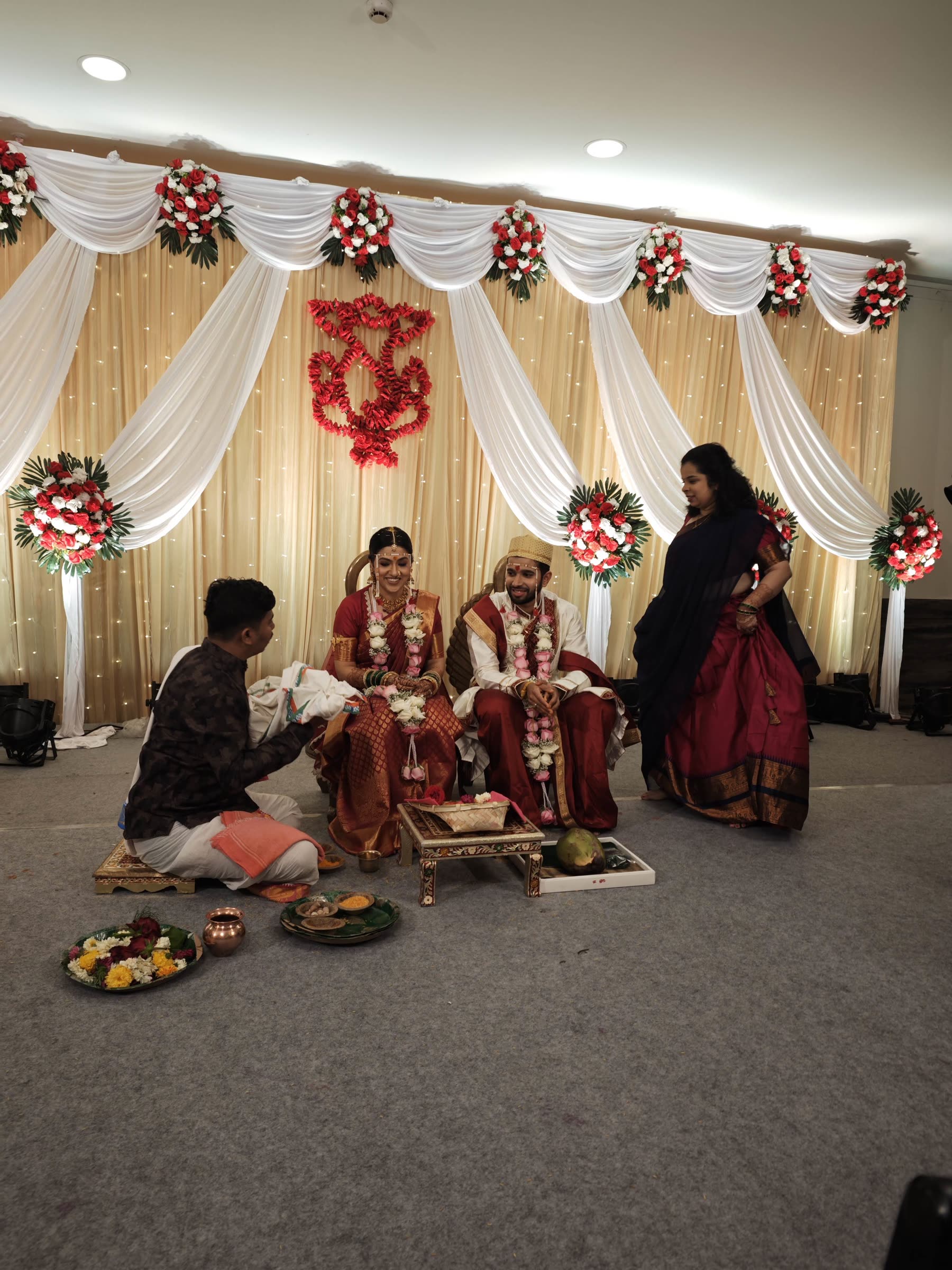 Sarika and Varad seated during a wedding ritual