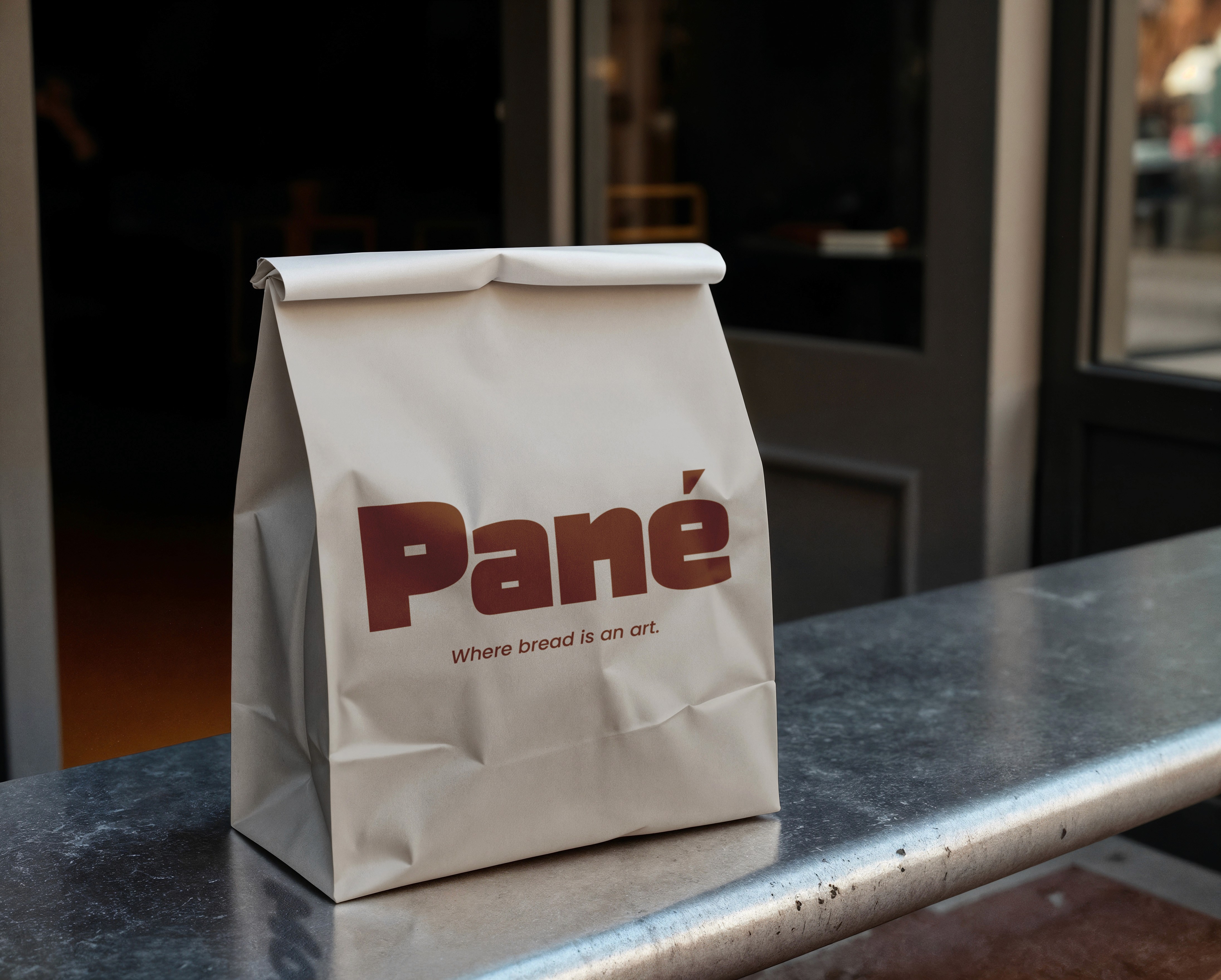 A close-up of a hand wearing multiple decorative rings against a blue background.