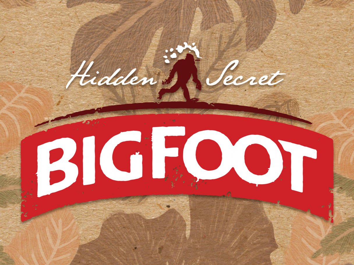 Rustic cabin in a golden field at sunset