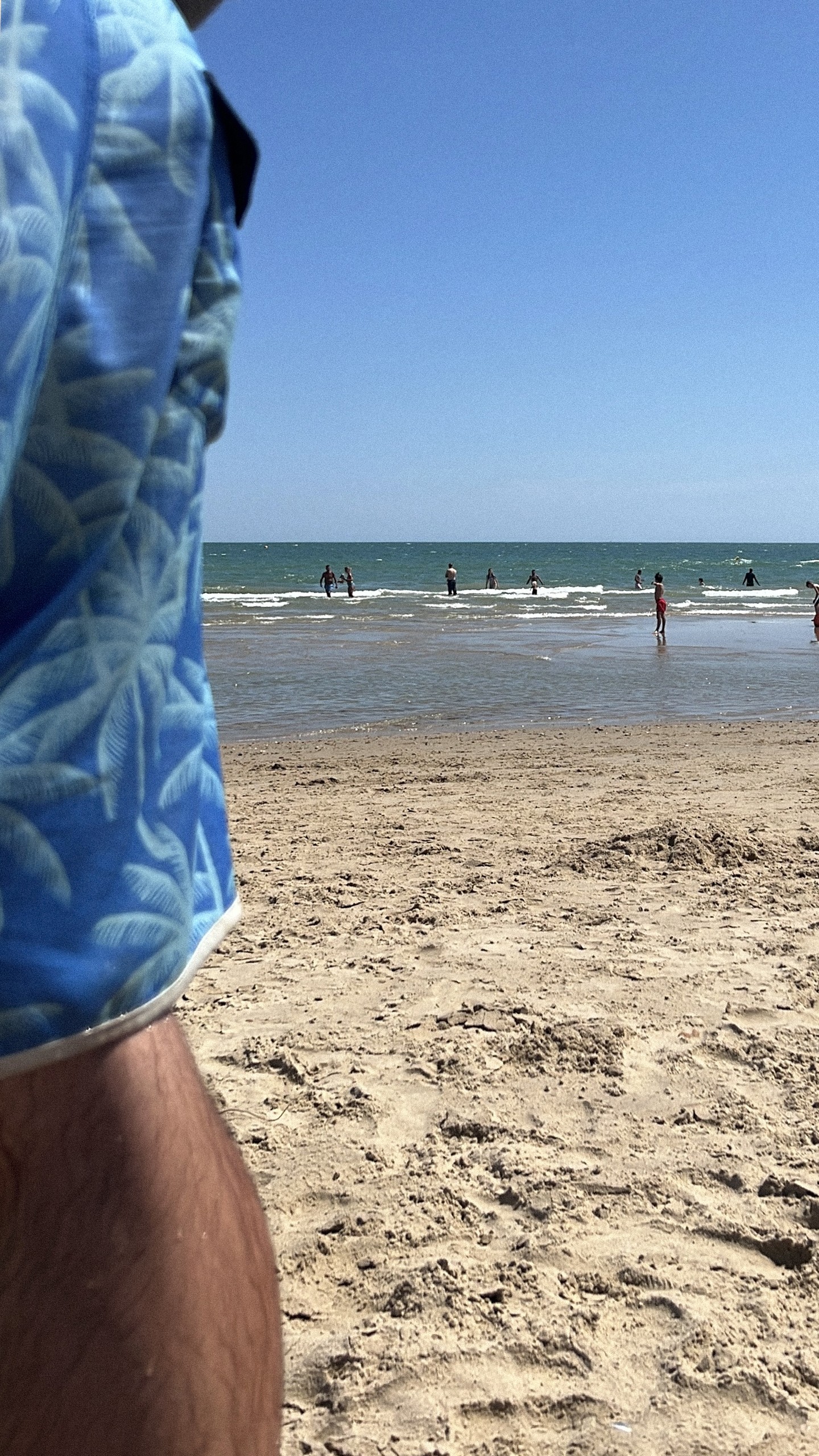 Afternoon sea dip on the beach during a hot July at Greenlights
