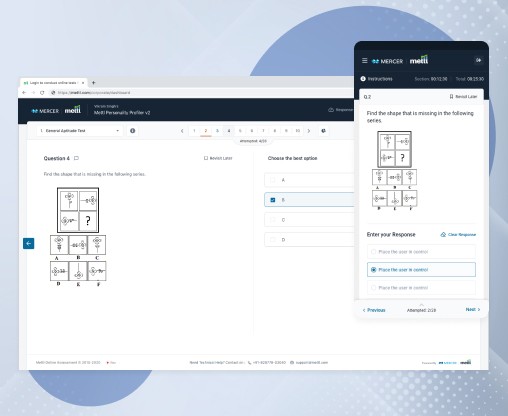 A person sitting at a desk using a laptop computer
