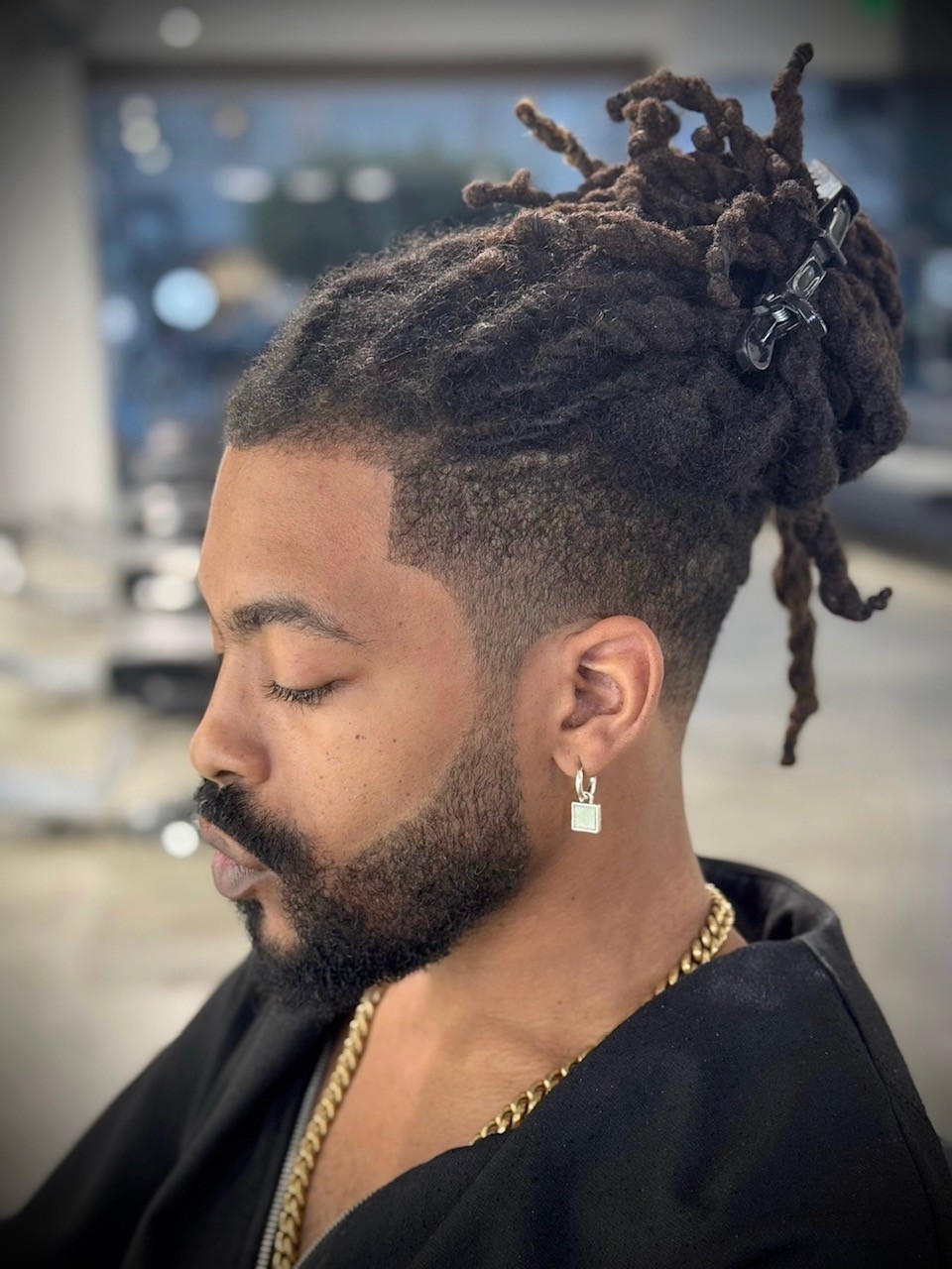 Facial grooming and sharp beard shaping paired with a smooth fade for a confident look. Courtney Palmore, The Rich Barber West Hollywood, Los Angeles