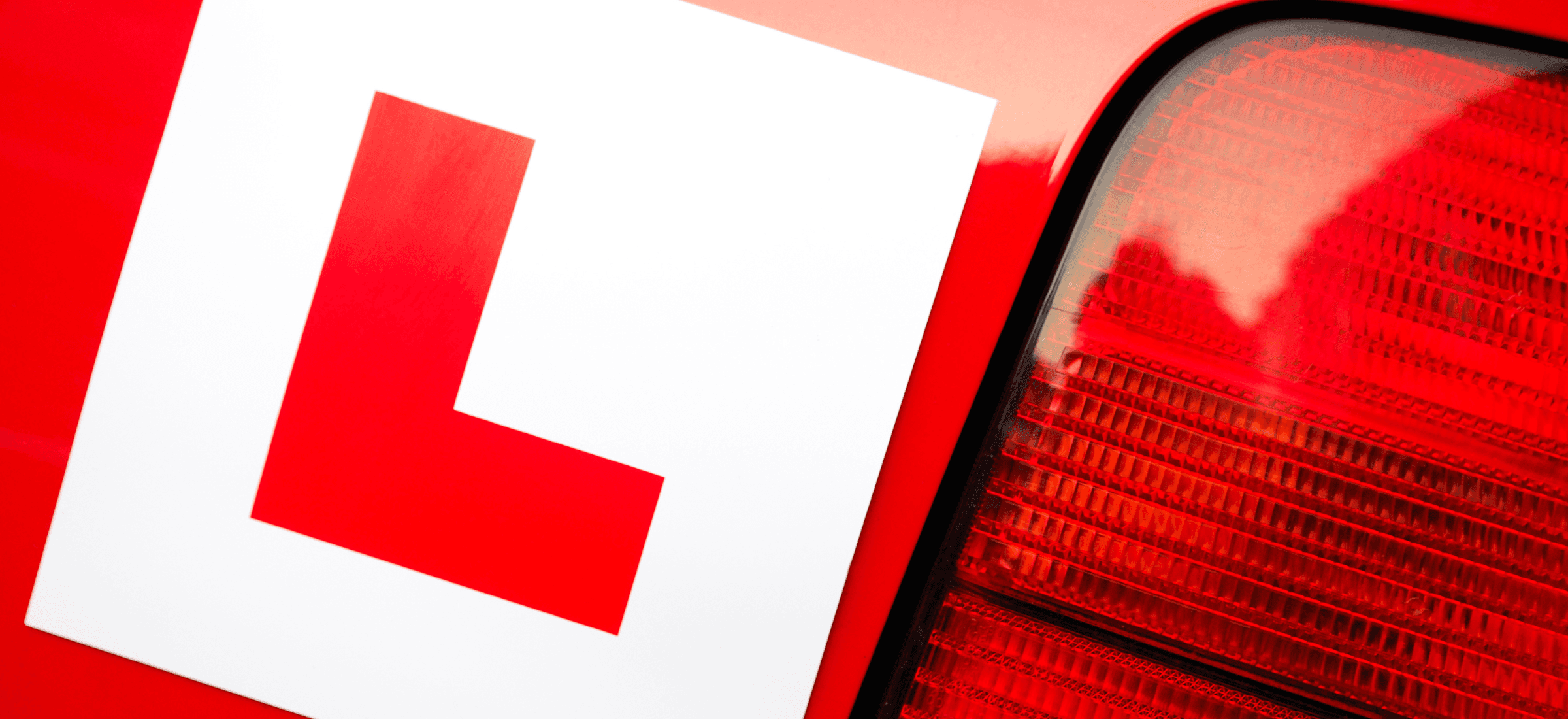 young female driver smiling and happy with her its4women telematics car insurance