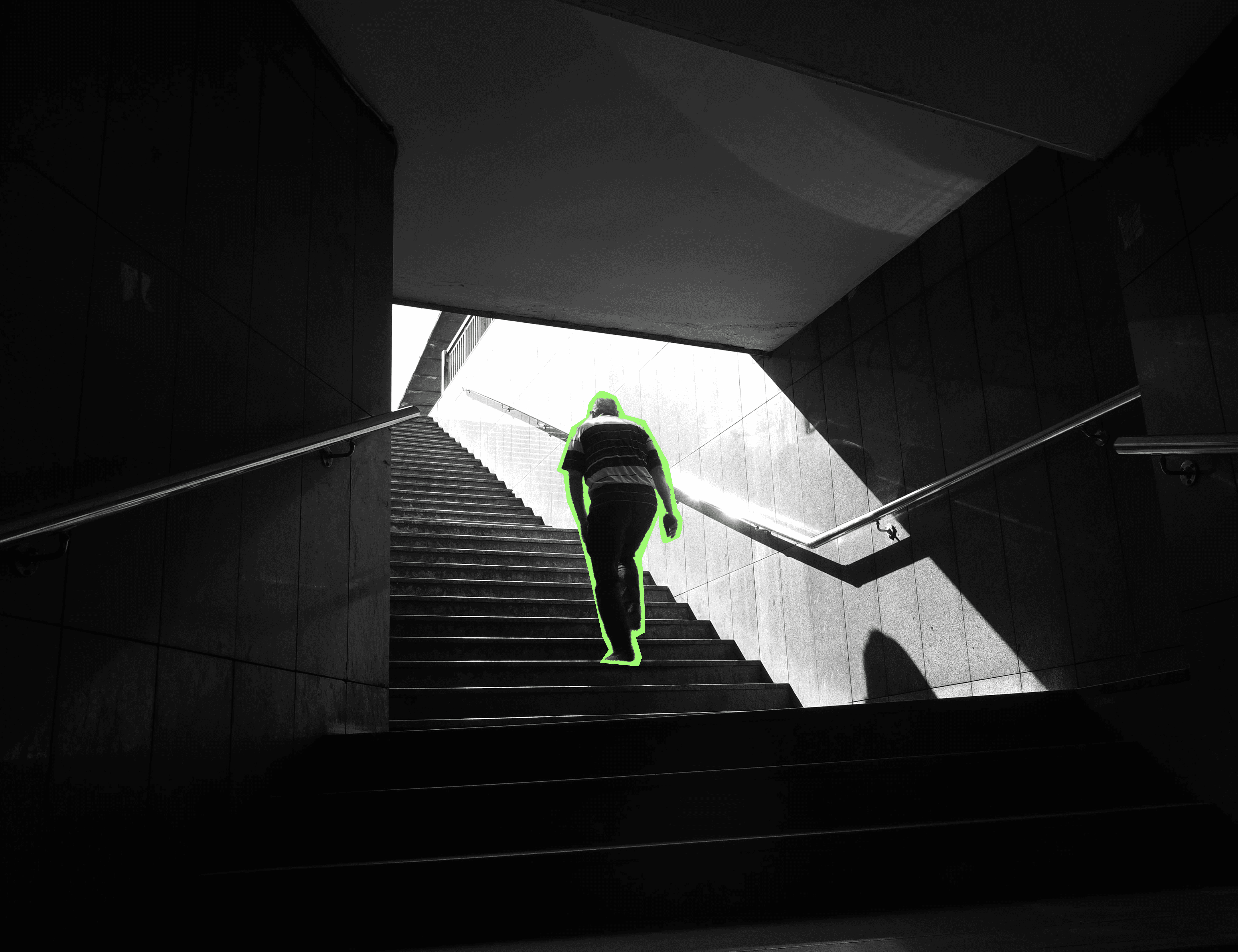 A man walking up the stairs