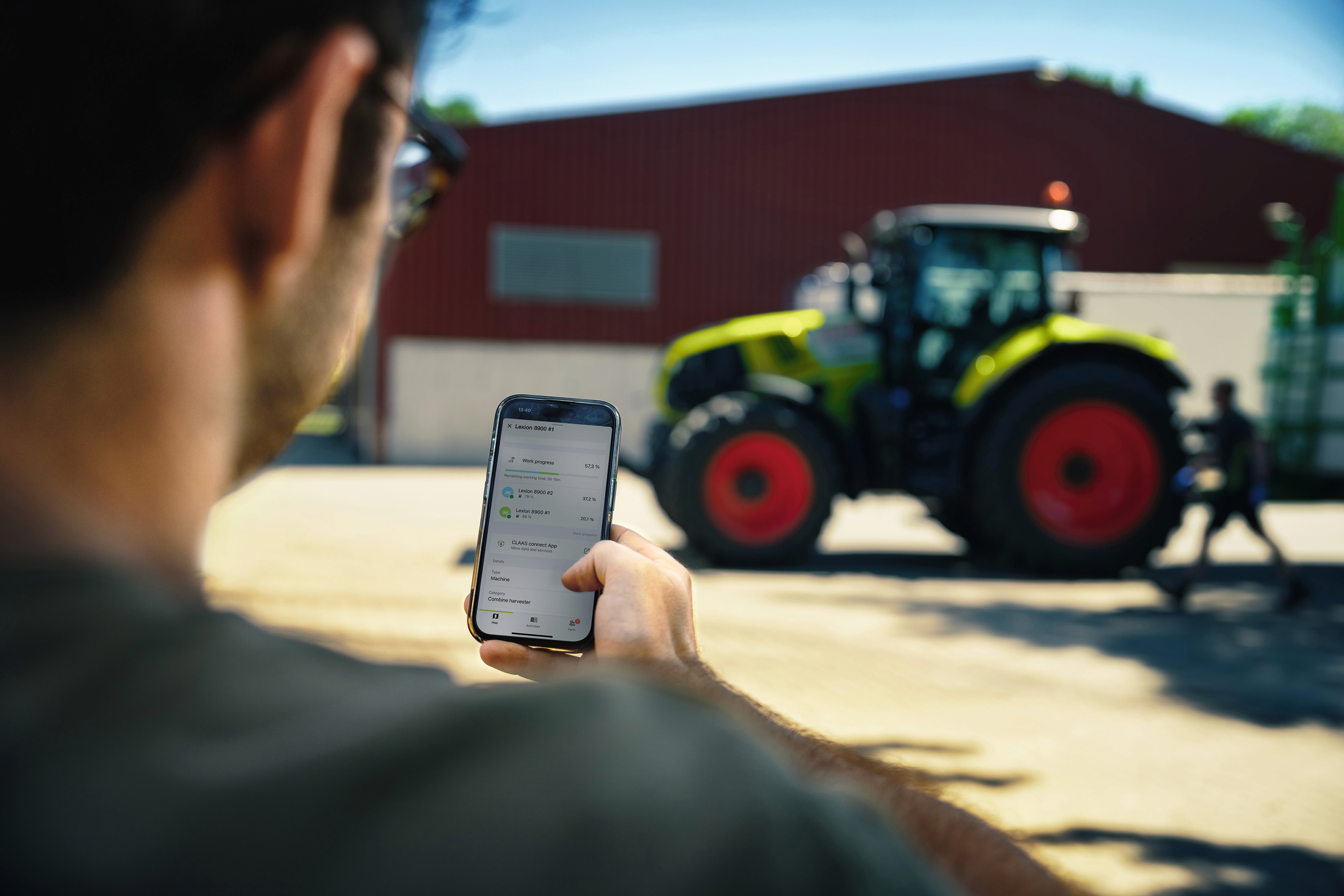 Aerial view of a winding road cutting through rocky terrain with patches of grass.