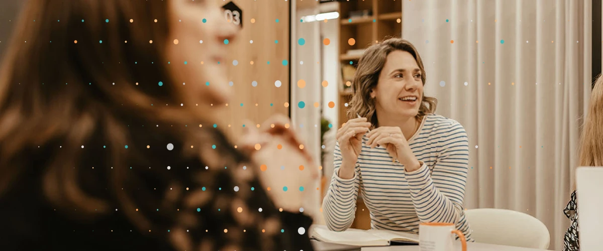 person smiling in a strategy meeting