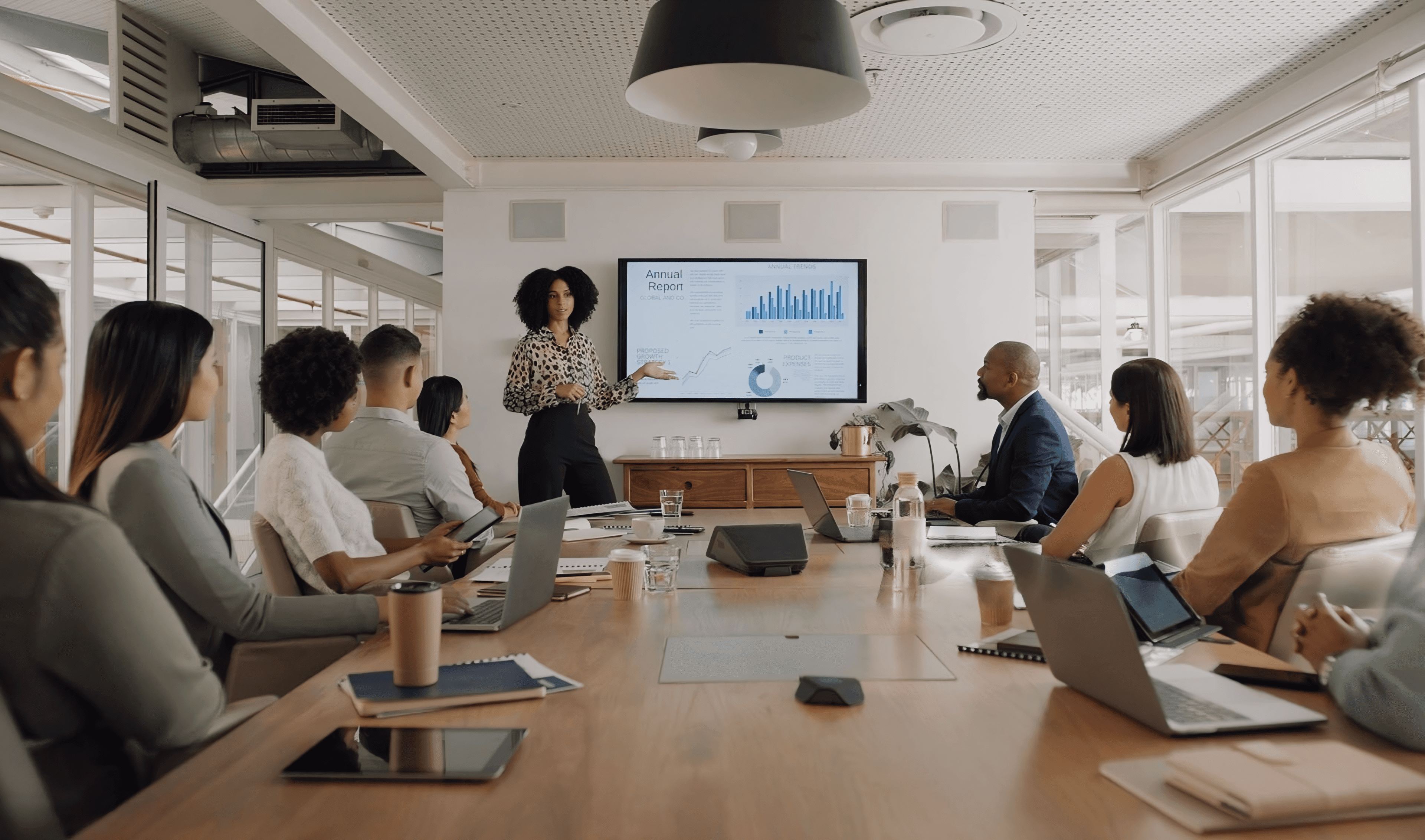 Team presenting Power BI dashboards and enterprise analytics solutions in a modern business meeting.