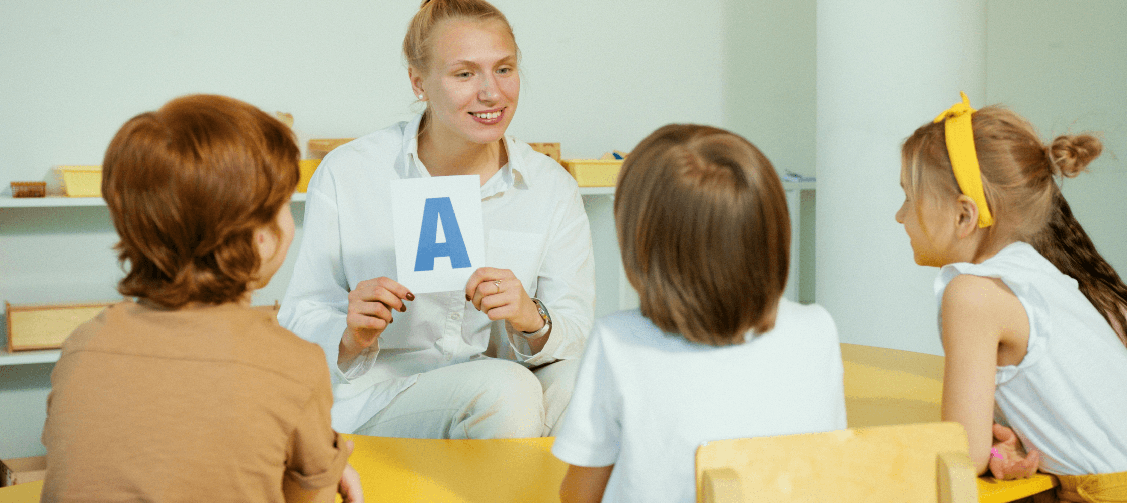 Teacher in class with children.