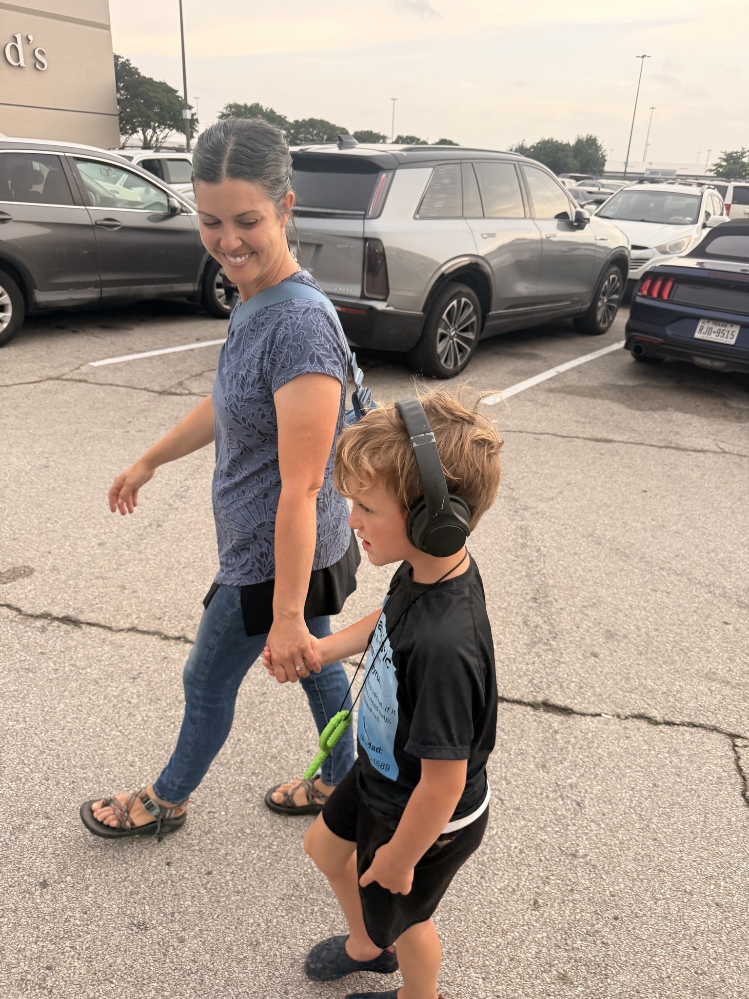 Brittney and their son in a parking lot in Forney, Texas