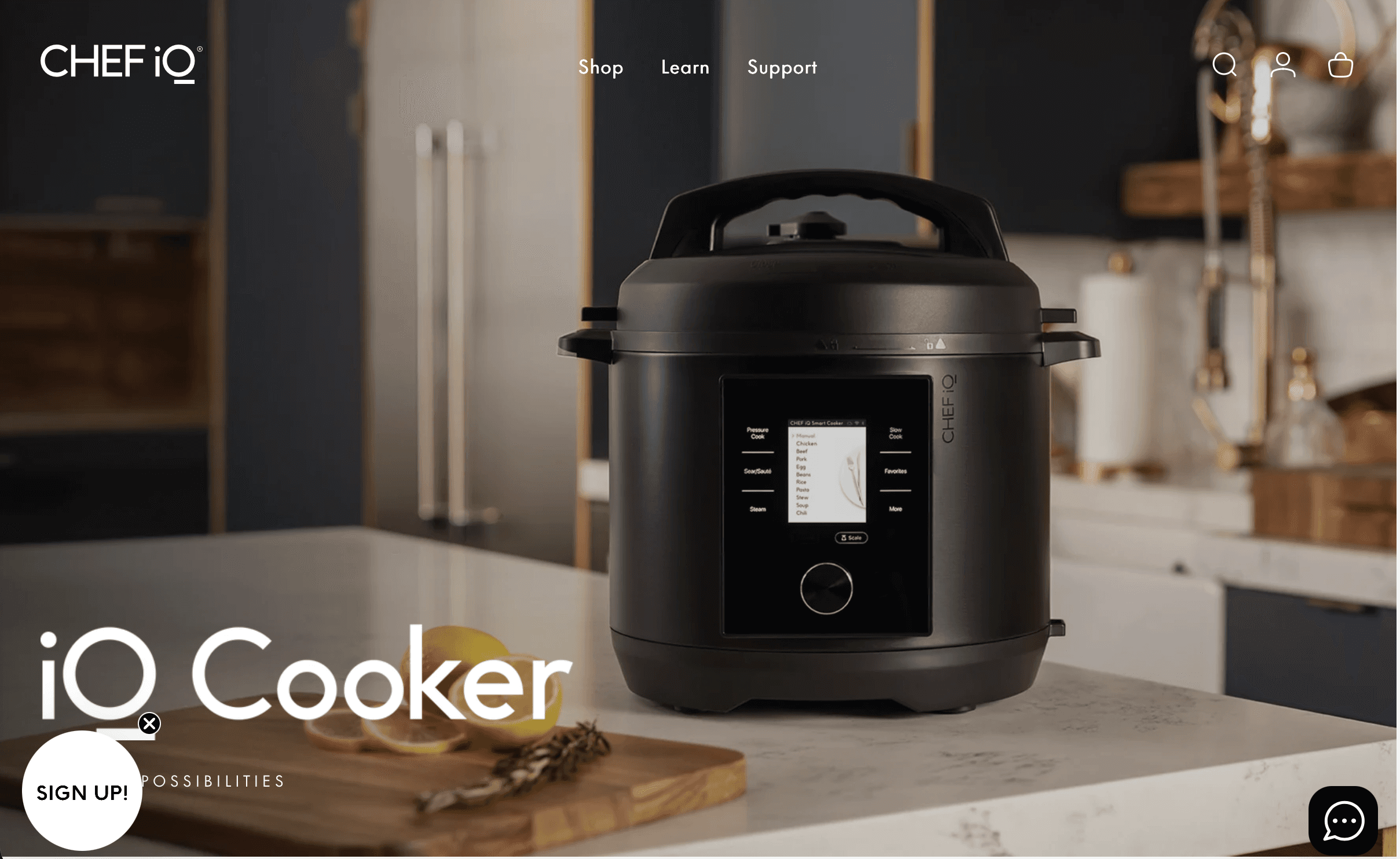 Black CHEF iQ iQ Cooker on a kitchen counter with its touchscreen visible.