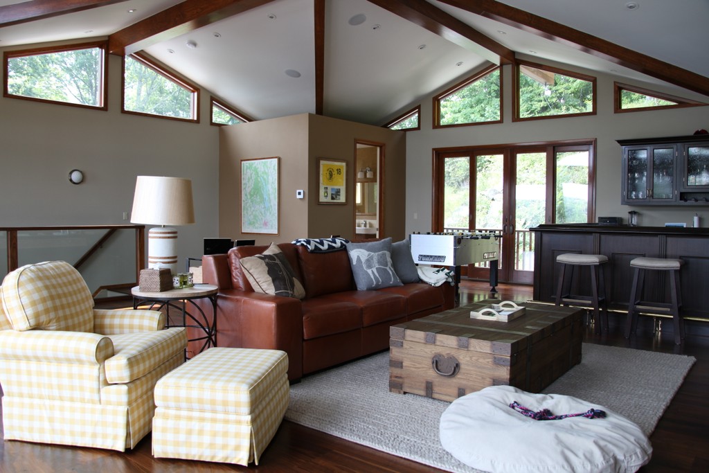 beautifully furnished living space with custom bar