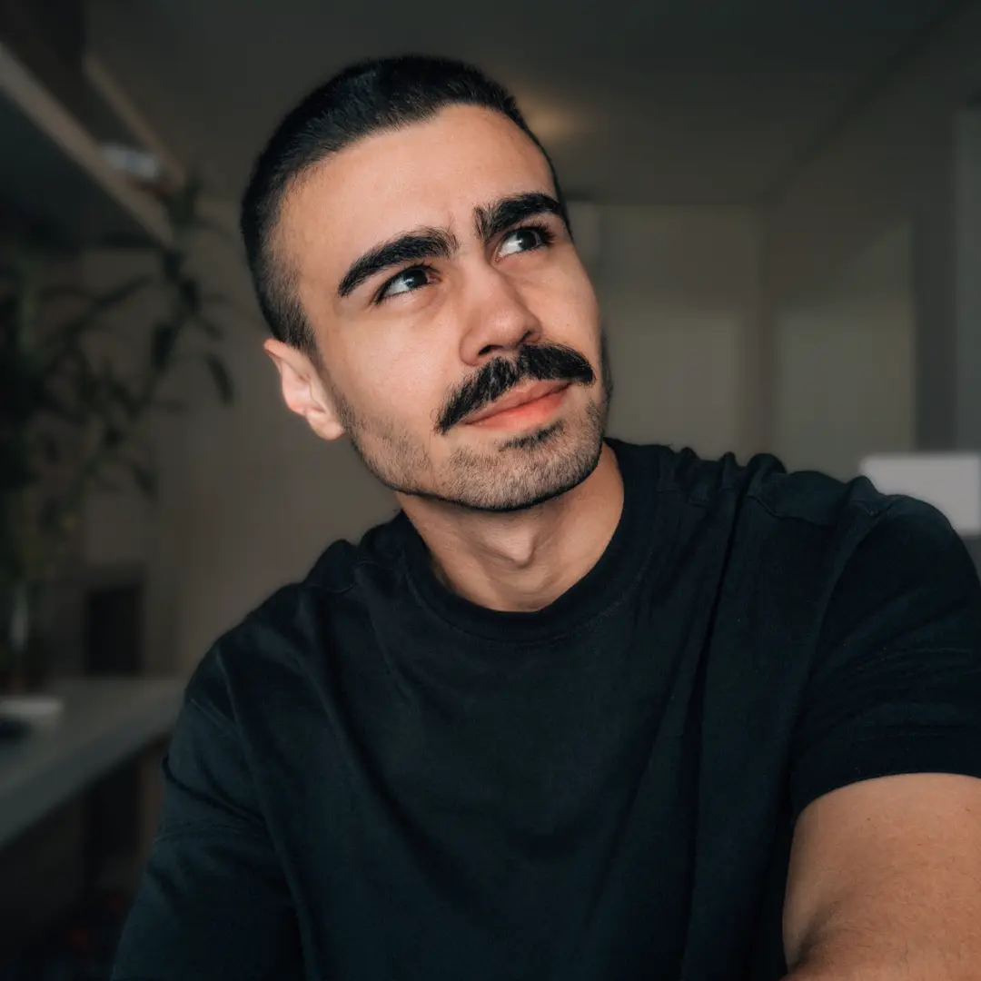 Memoji of a male face smiling