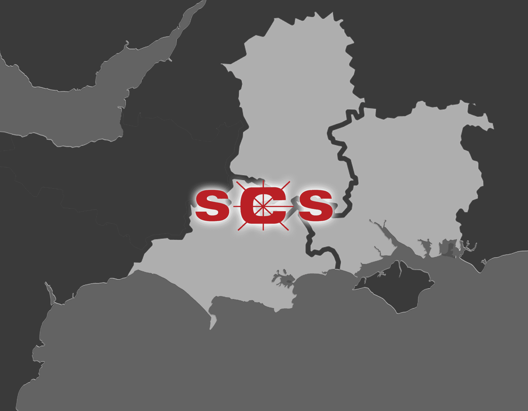 person holding magnifying glass near desk globe