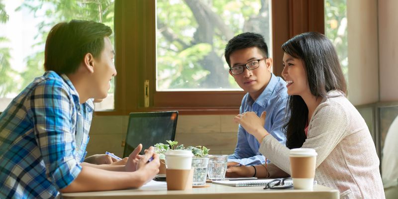 Cafe owner having a meeting with a potential business partner in a cafe