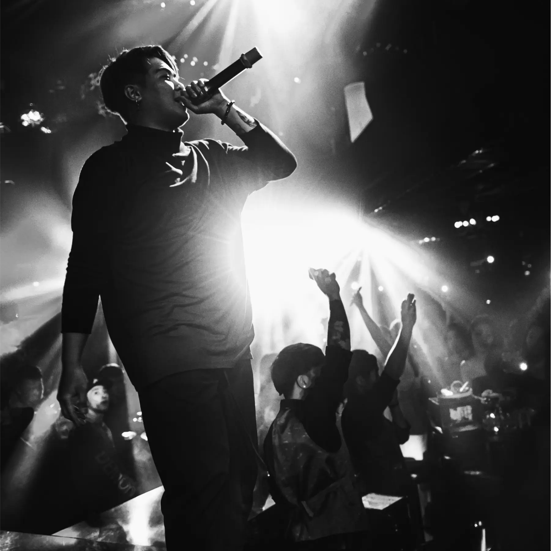 A vocalist performing on a music concert.