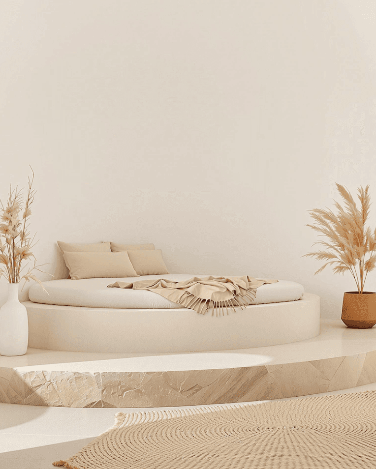 Bright coastal bedroom with soft curtains, cozy bed, and ocean view balcony.