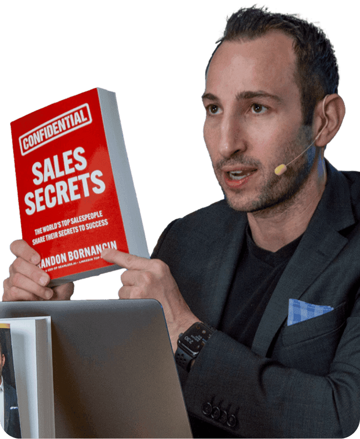 Brandon with the book "Sales Secrets"