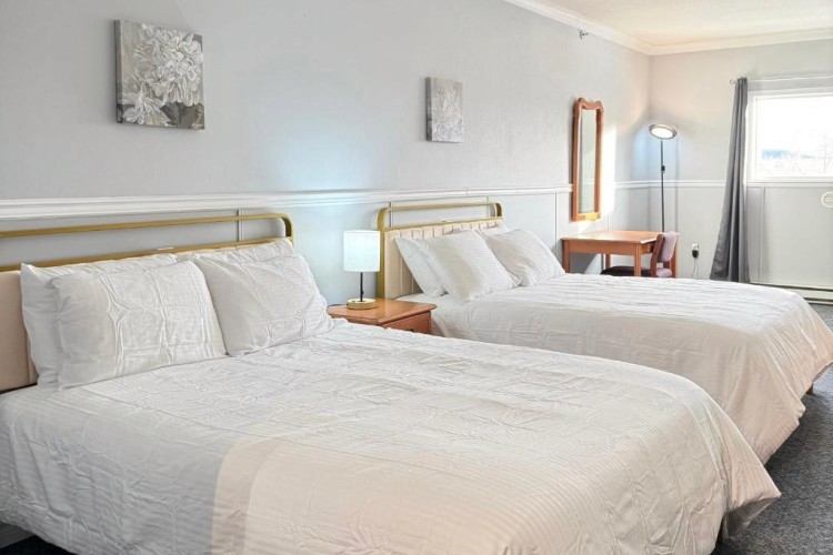 sunloungers fronting buildings near mountain