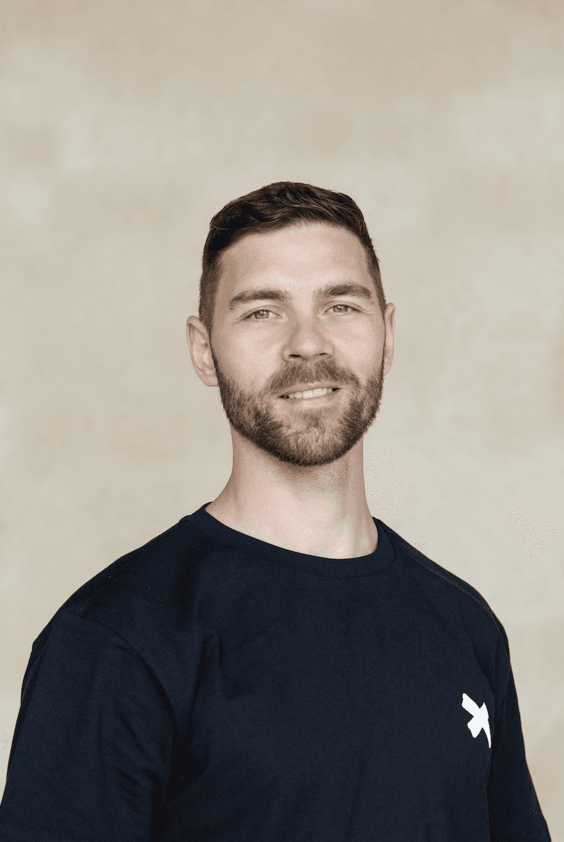 a blurry photo of a person standing in front of a wall