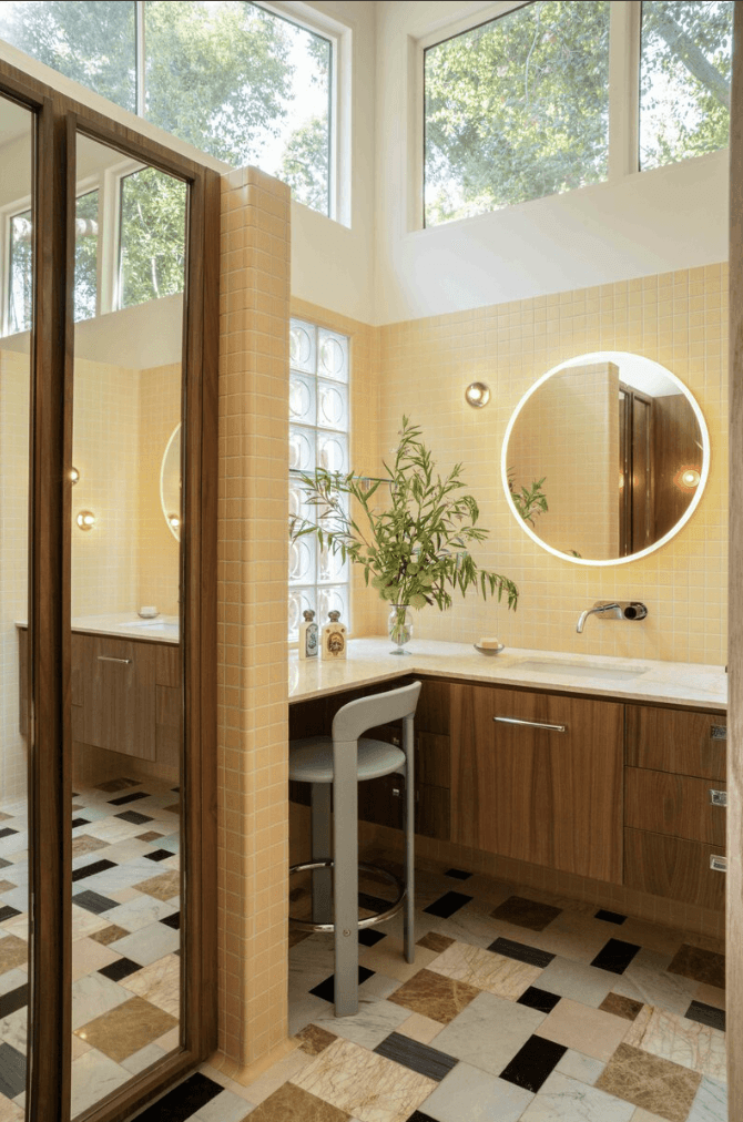 Bright bathroom with geometric black and white floor tiles and greenery — The Warren project