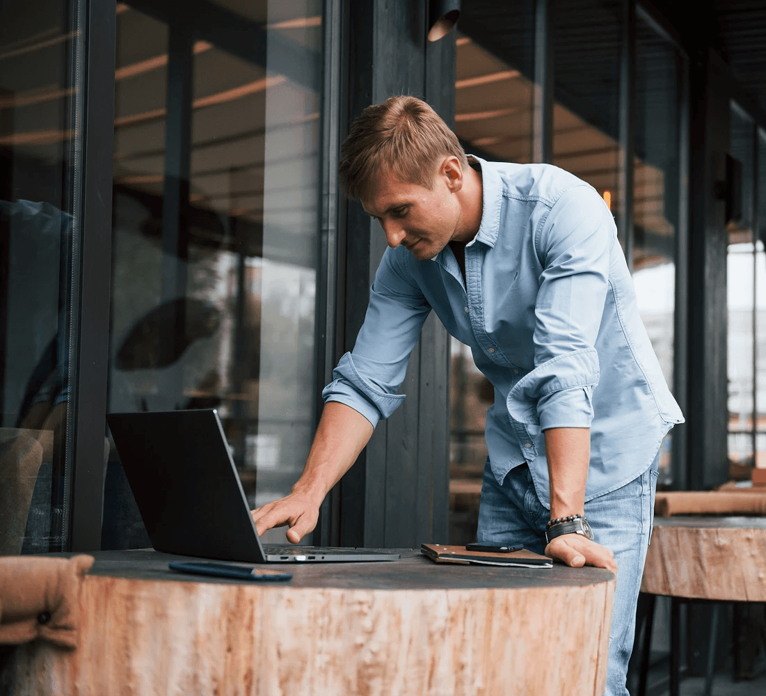 two ladies looking at a laptop and smiling