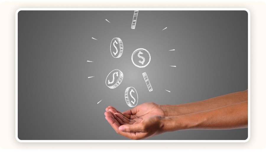 Coins above two hands