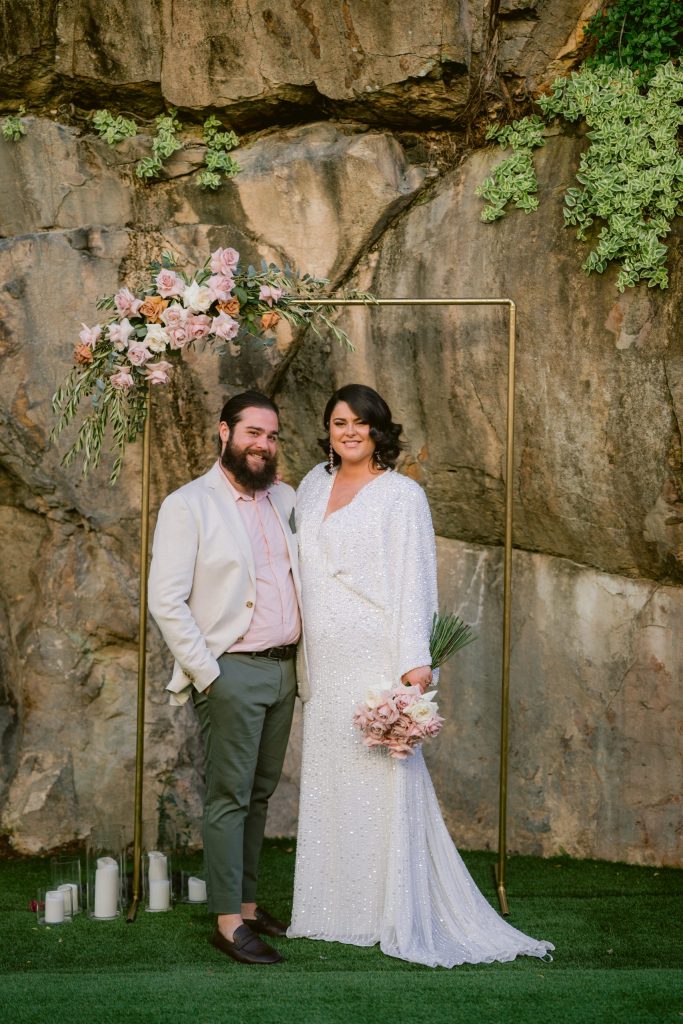 Bride & Groom posed at their alter