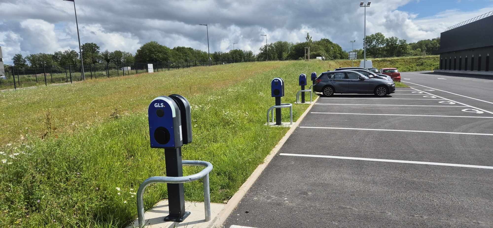 a man pumping gas into his car at a gas station